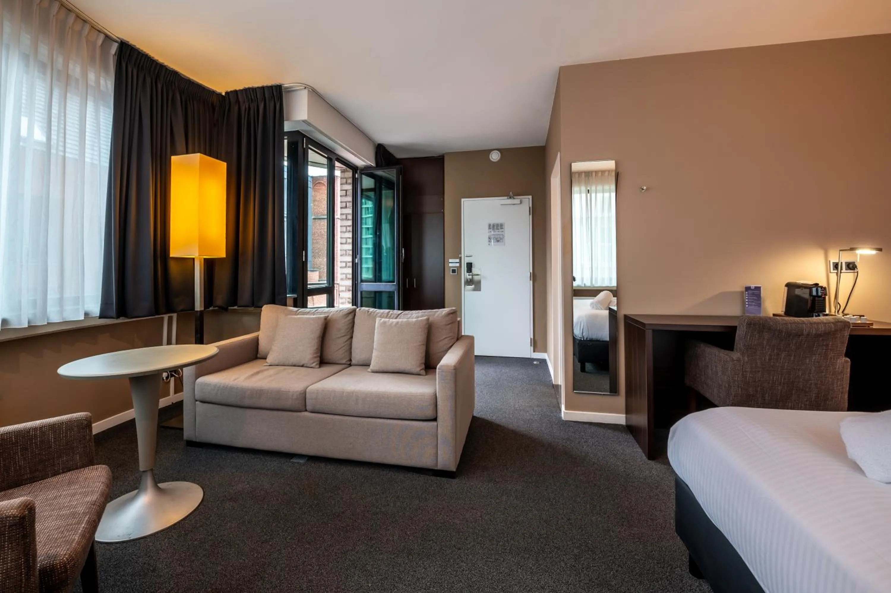 Seating area, Bed in Hotel Docklands Antwerpen