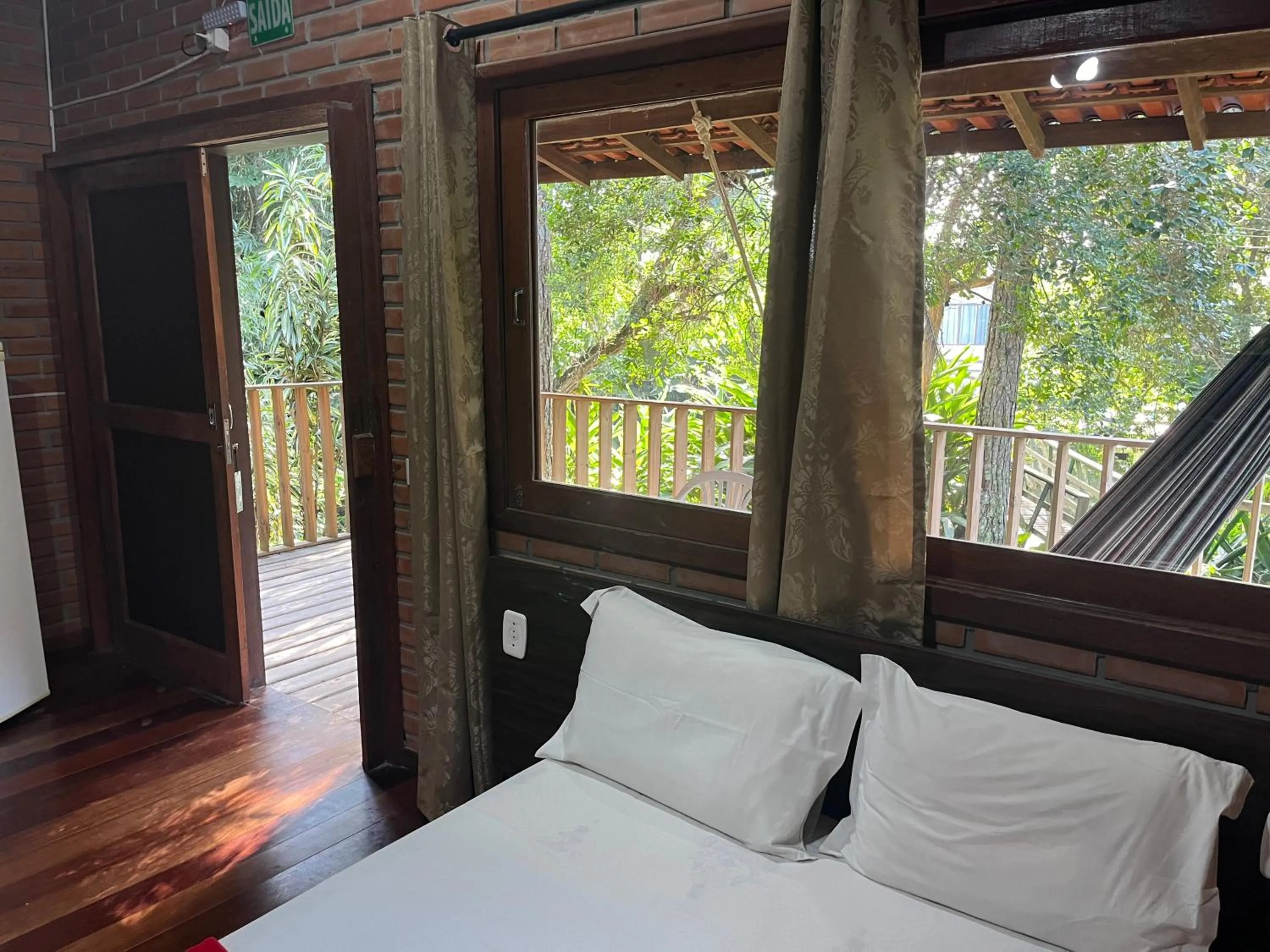 Balcony/Terrace, Bed in Pousada Nosso Bosque