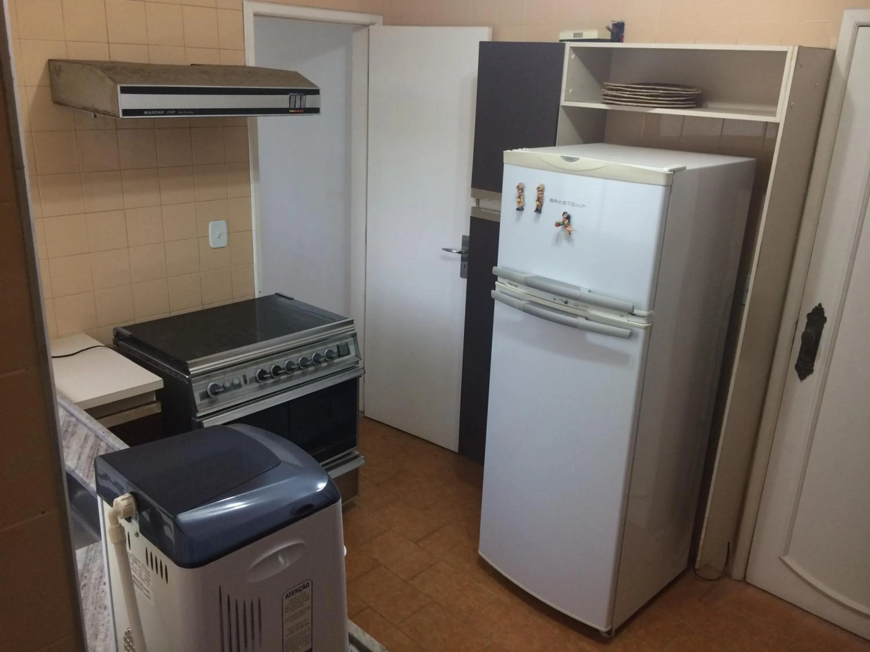 Kitchen or kitchenette in Apartamento Guarapari Brisa do Mar