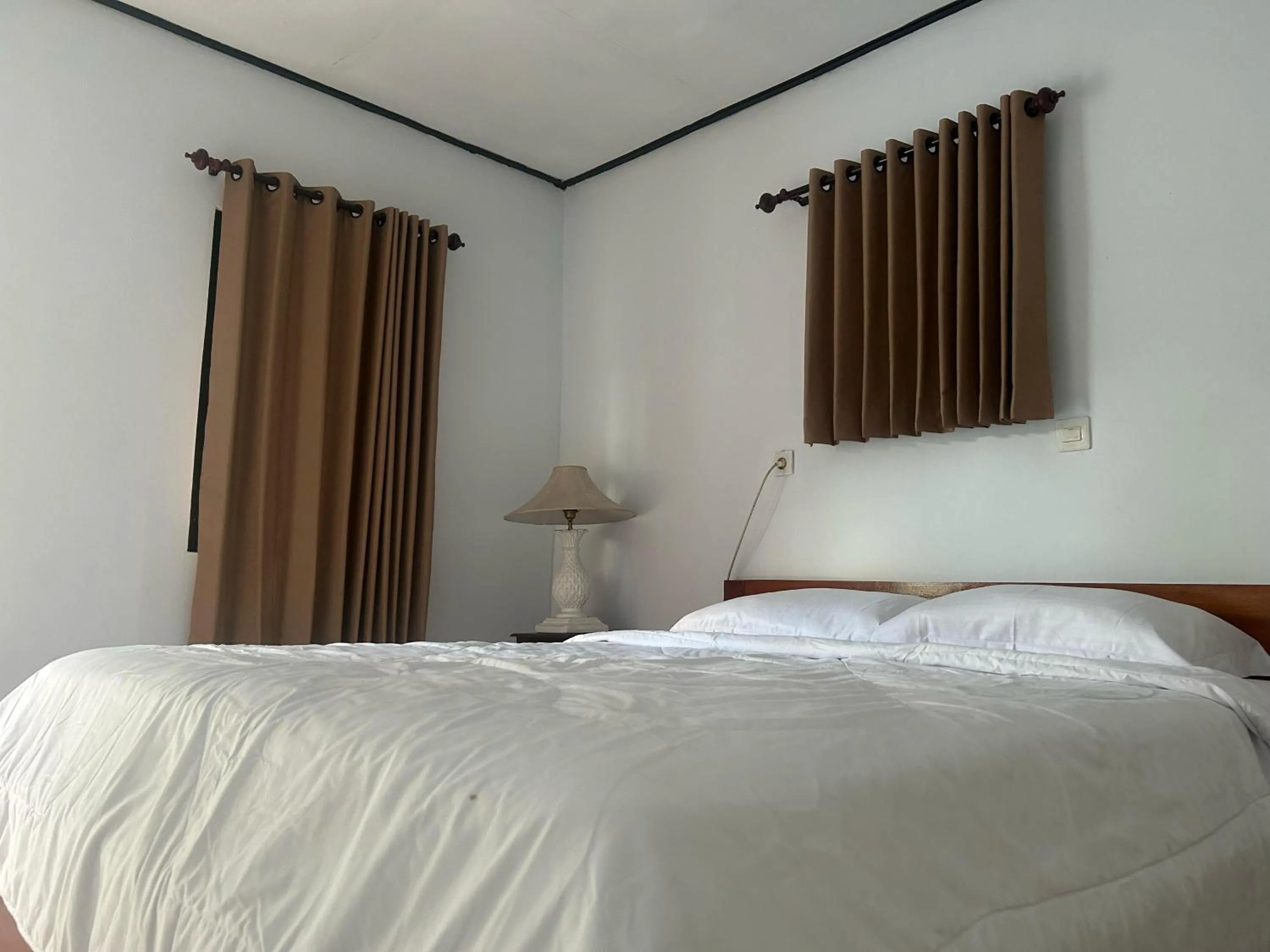 Bed in Darma Putra Hotel