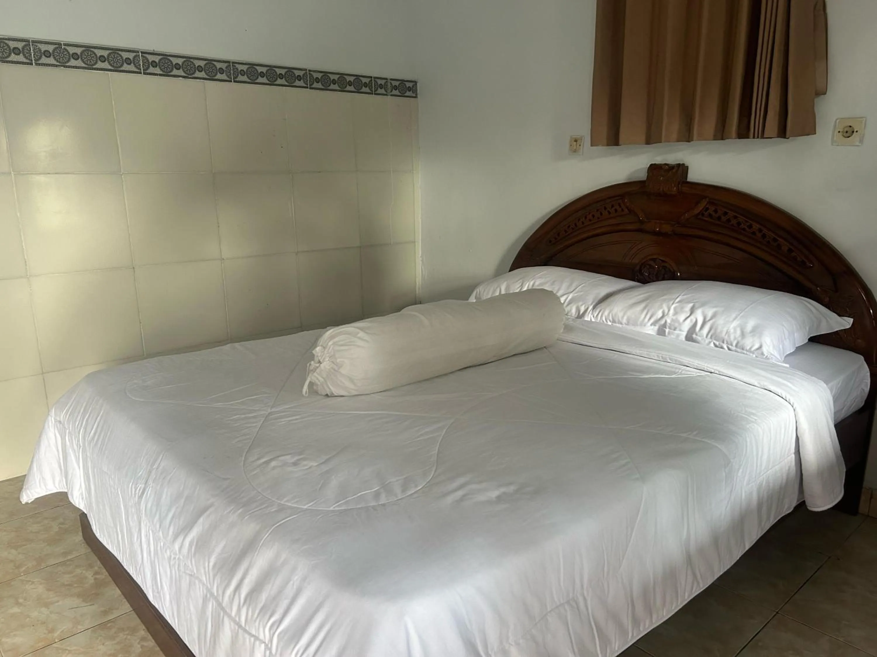 Bed in Darma Putra Hotel