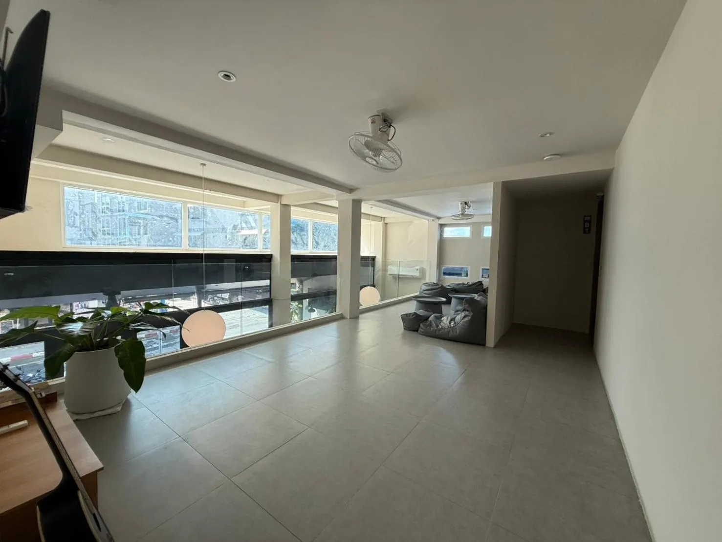 Communal lounge/ TV room in P168 Hostel Samui