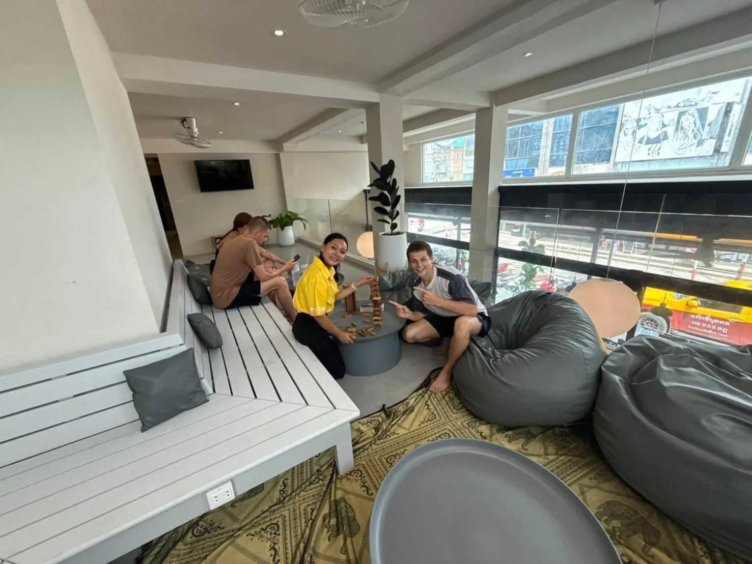 Communal lounge/ TV room in P168 Hostel Samui