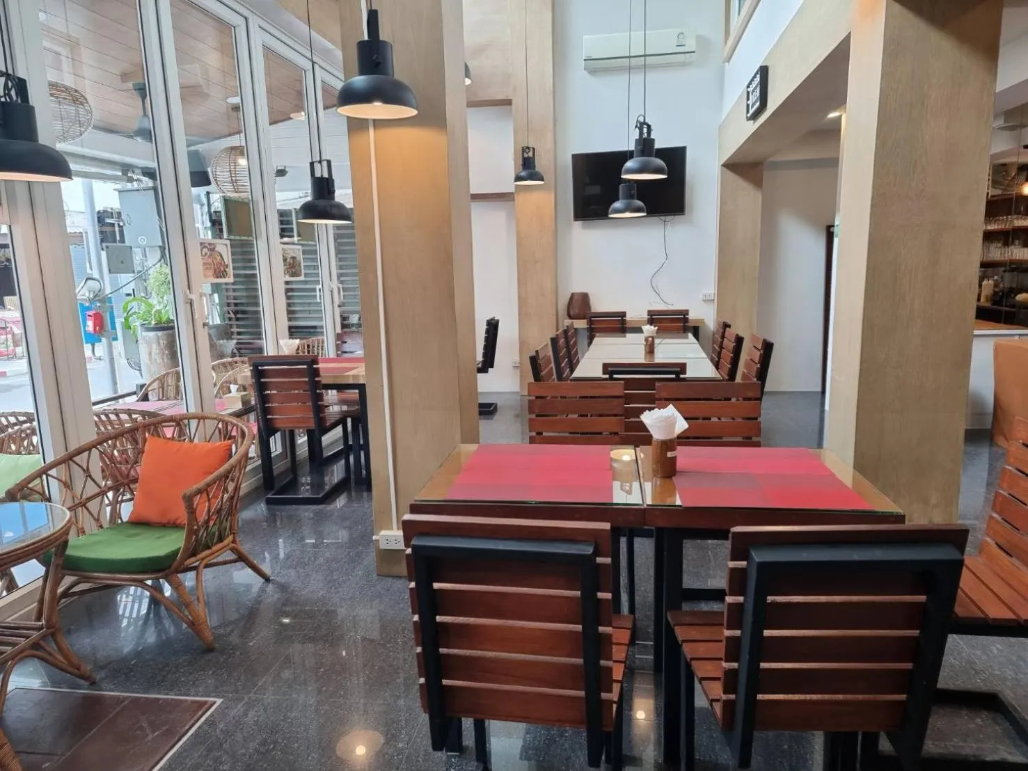 Communal lounge/ TV room in P168 Hostel Samui