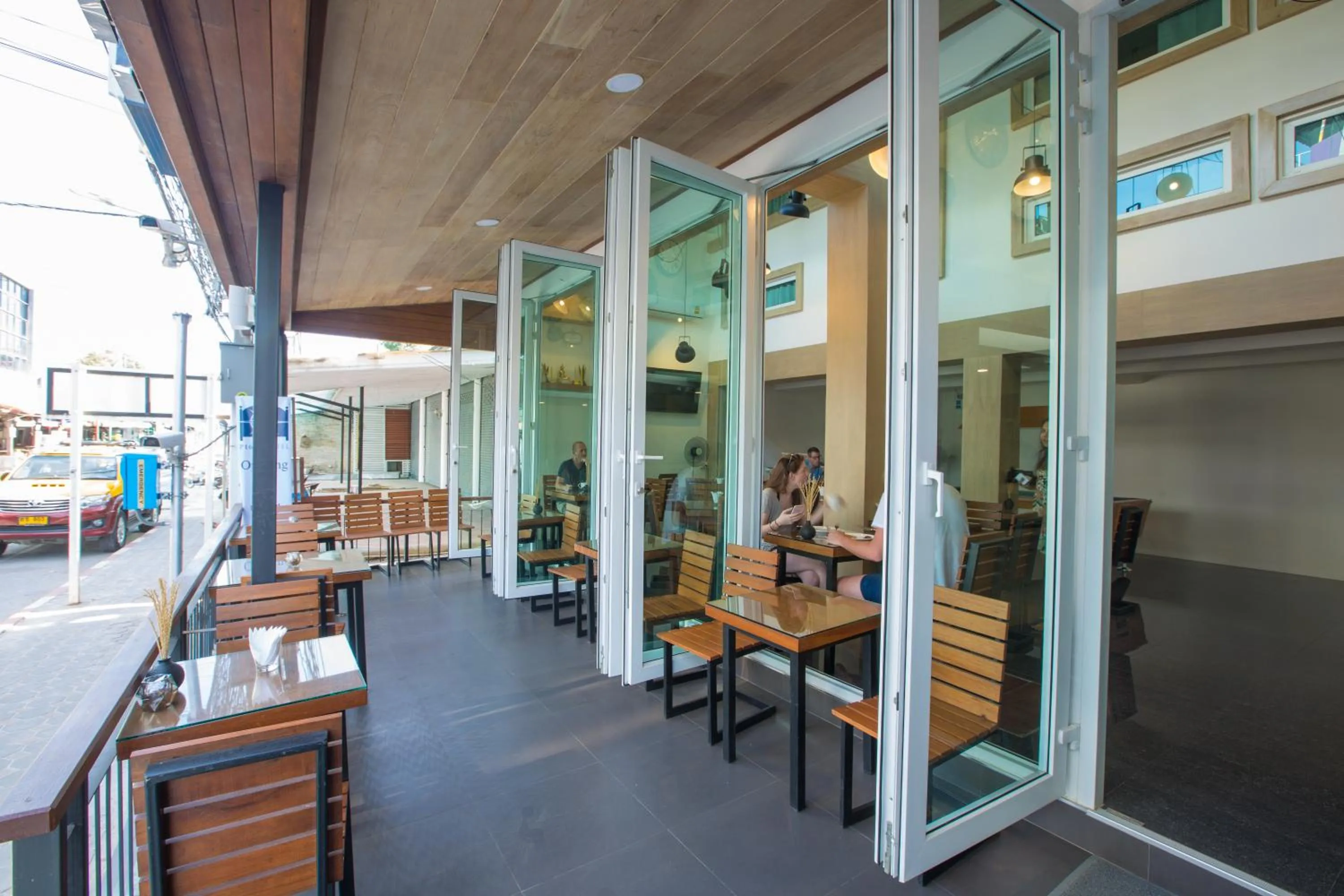 Communal lounge/ TV room in P168 Hostel Samui