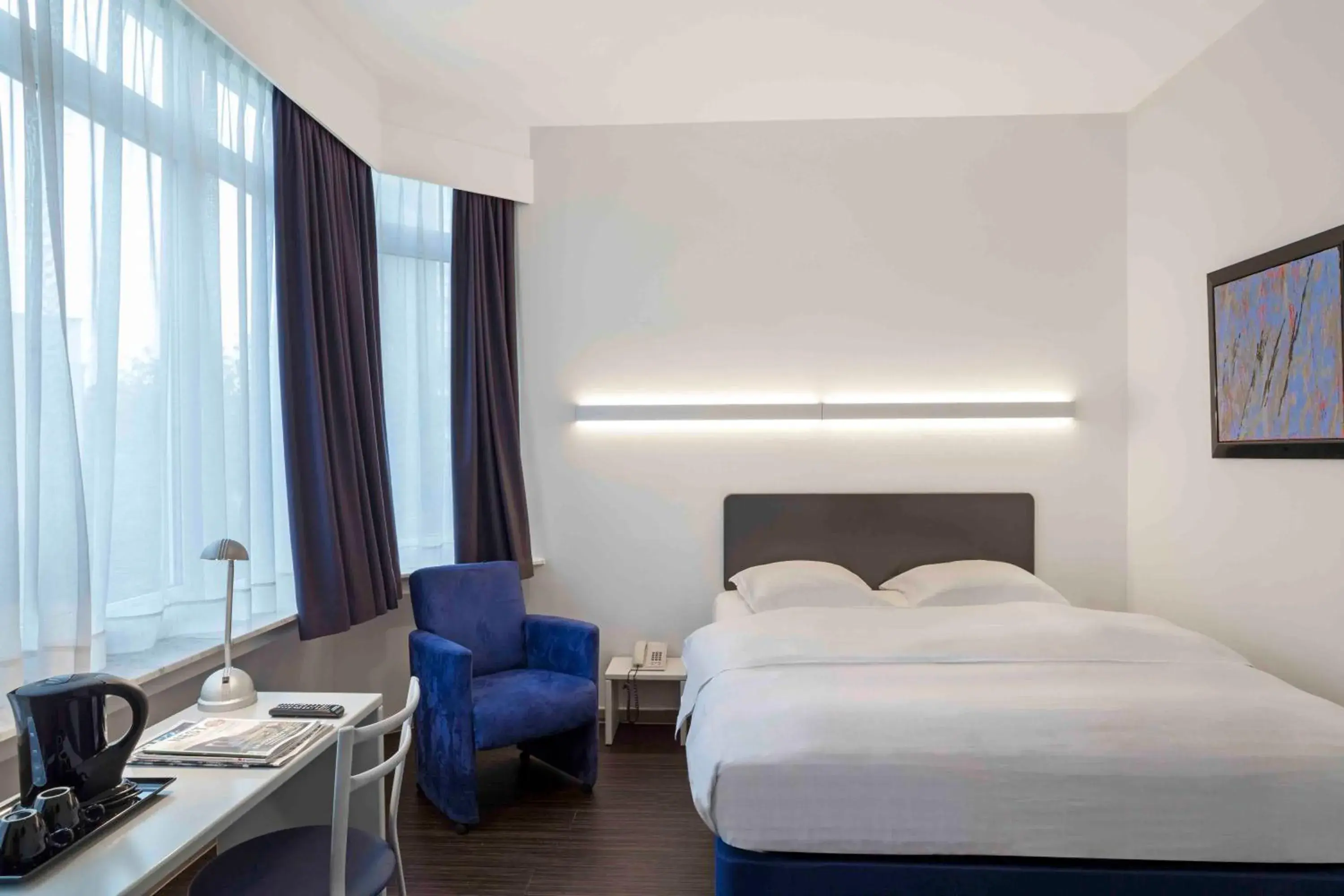 Bed in Hôtel Argus by happyCulture Bed in Hôtel Argus by happyCulture