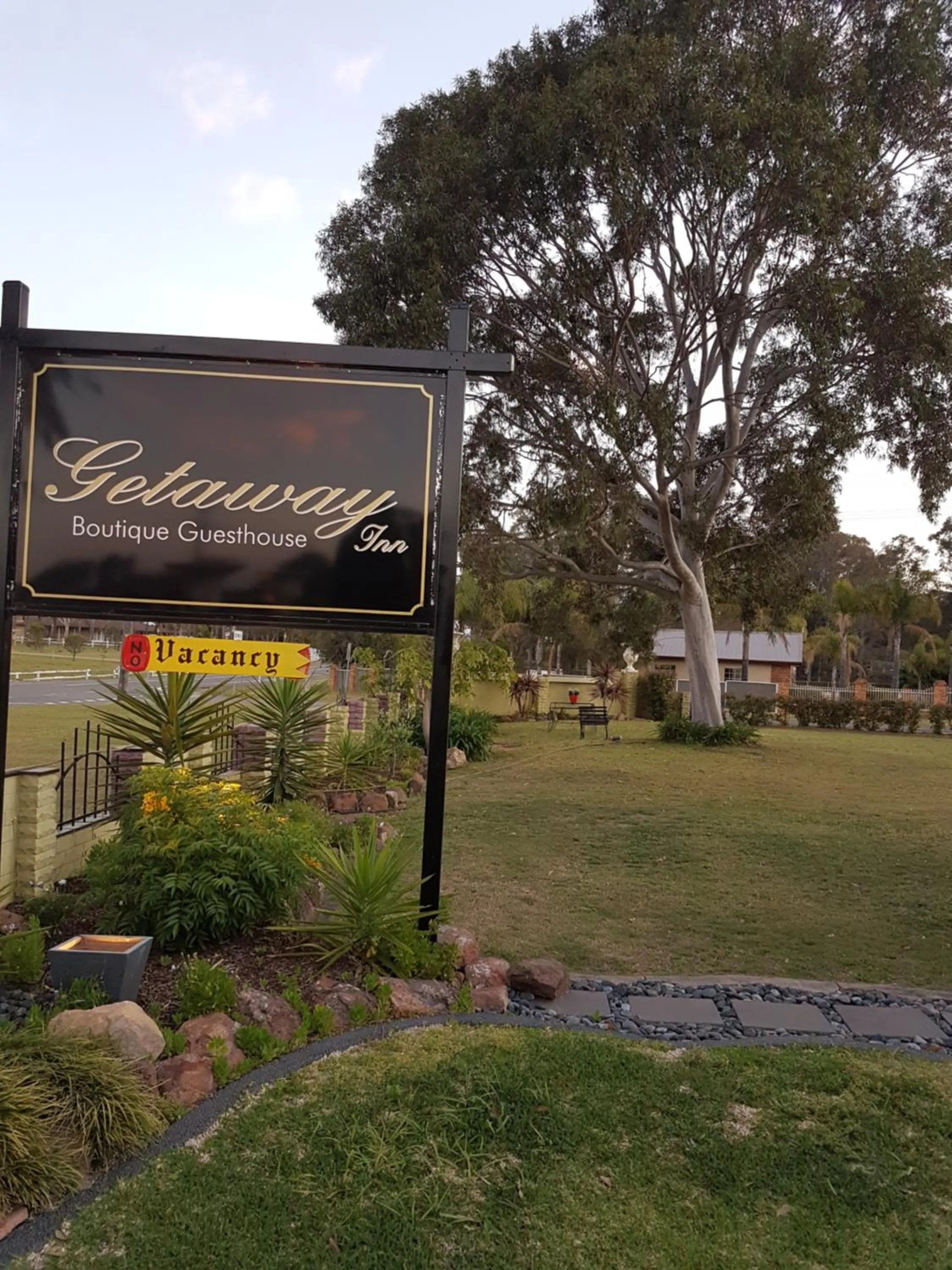 Property logo or sign in Getaway Inn Boutique Guest house