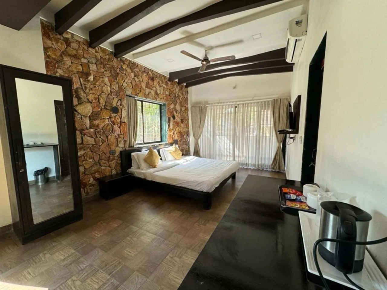 Bed in Gir Lions Paw Resort with Swimming Pool