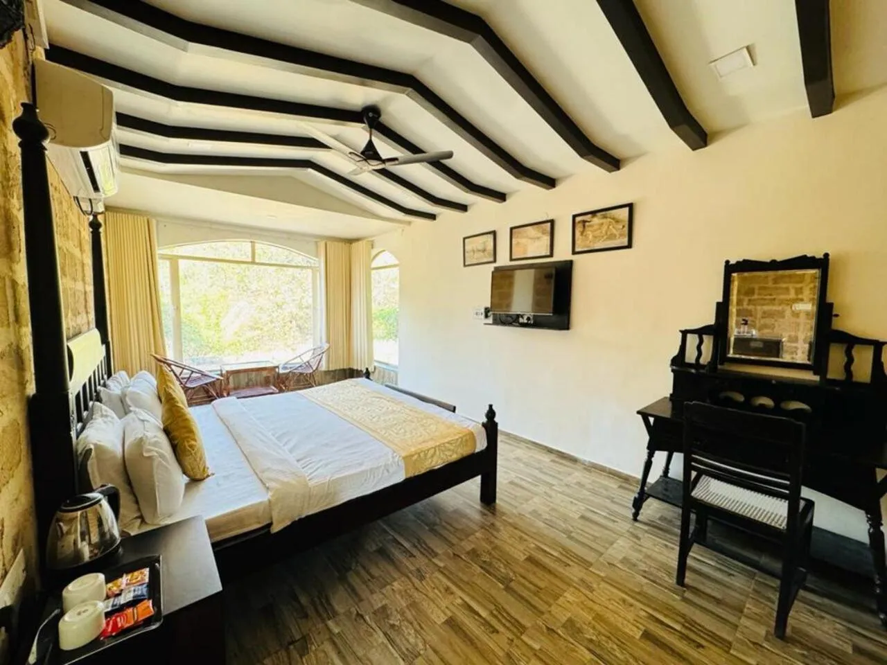 Bed in Gir Lions Paw Resort with Swimming Pool