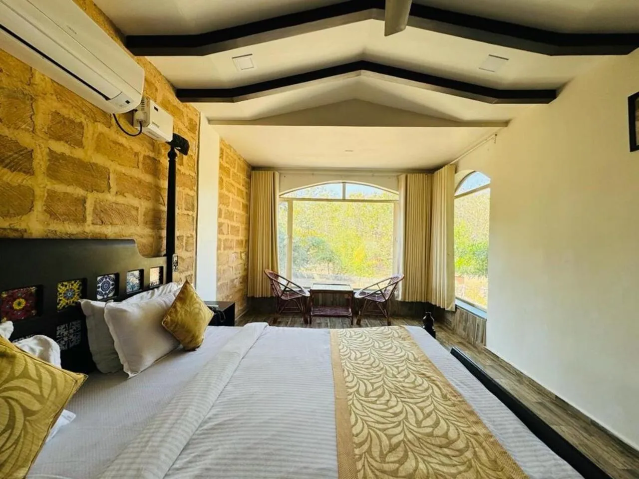 Bed in Gir Lions Paw Resort with Swimming Pool