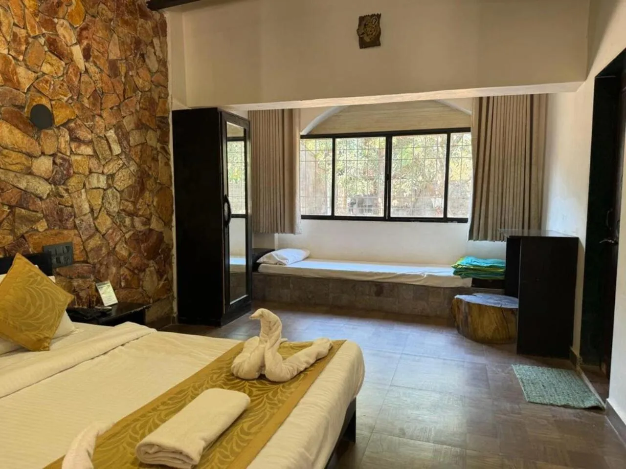 Bed in Gir Lions Paw Resort with Swimming Pool