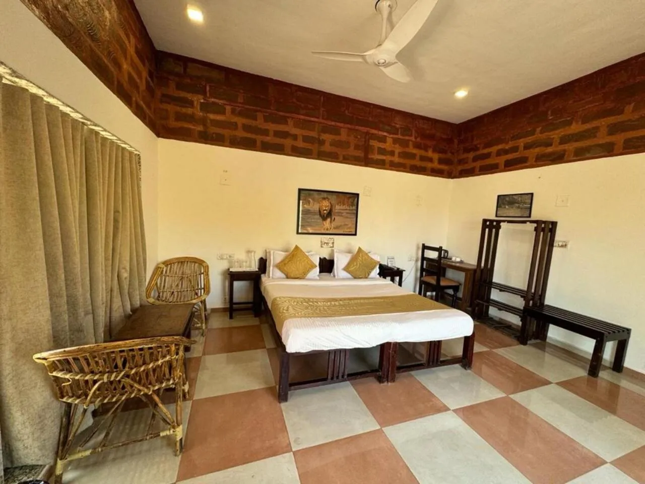 Bed in Gir Lions Paw Resort with Swimming Pool