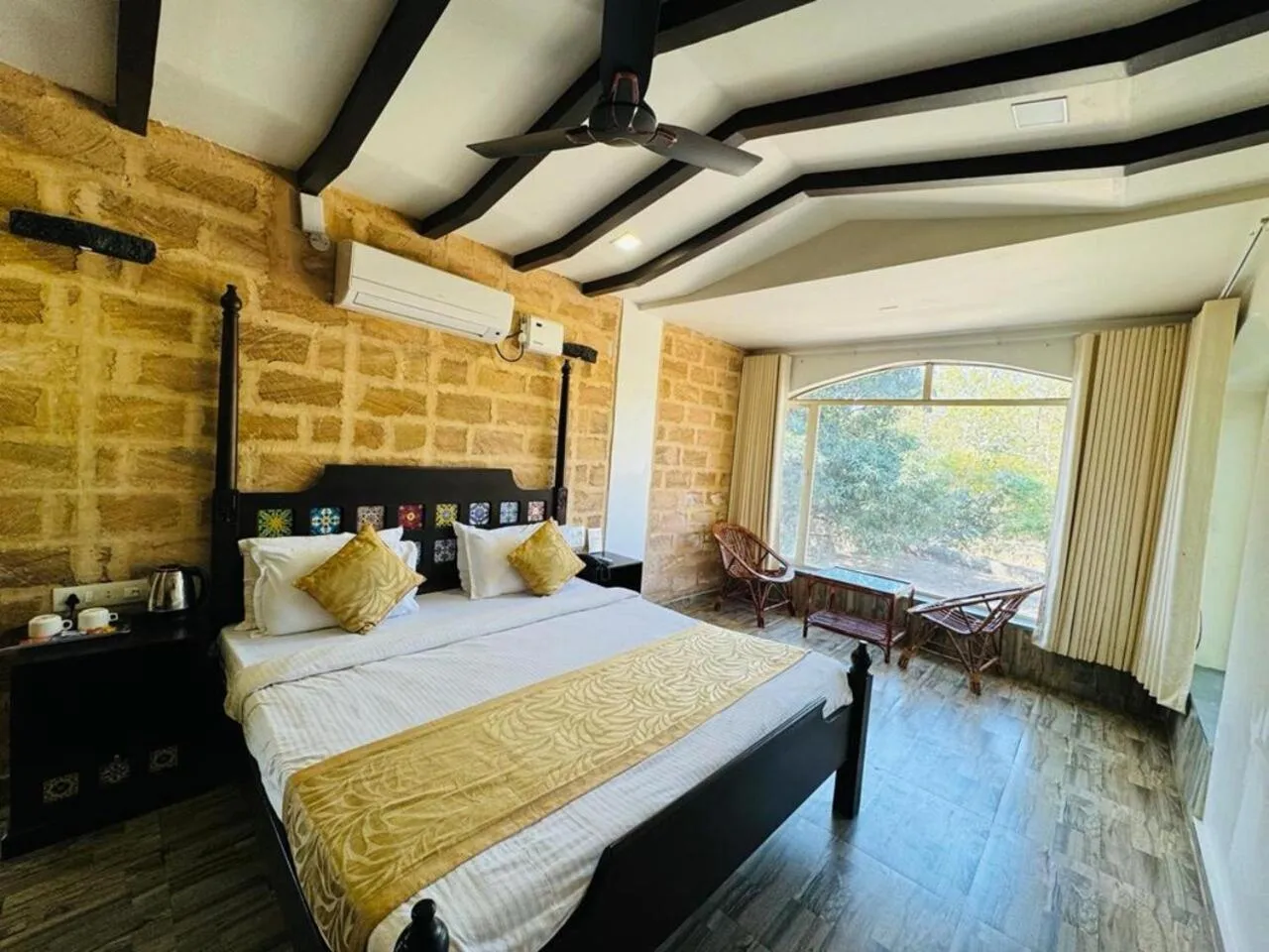 Bed in Gir Lions Paw Resort with Swimming Pool