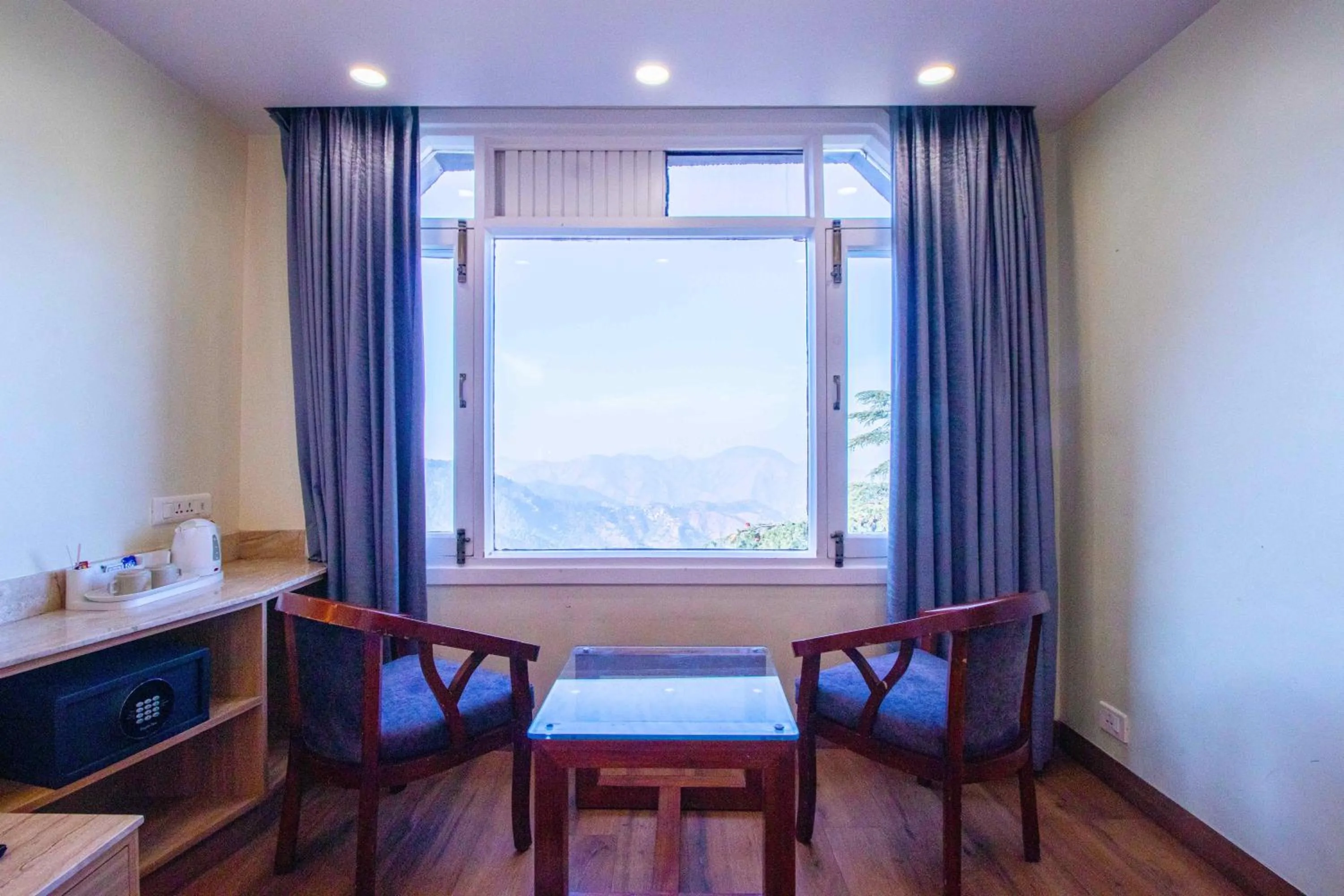 Seating area in Treebo Varuna With Mountain View