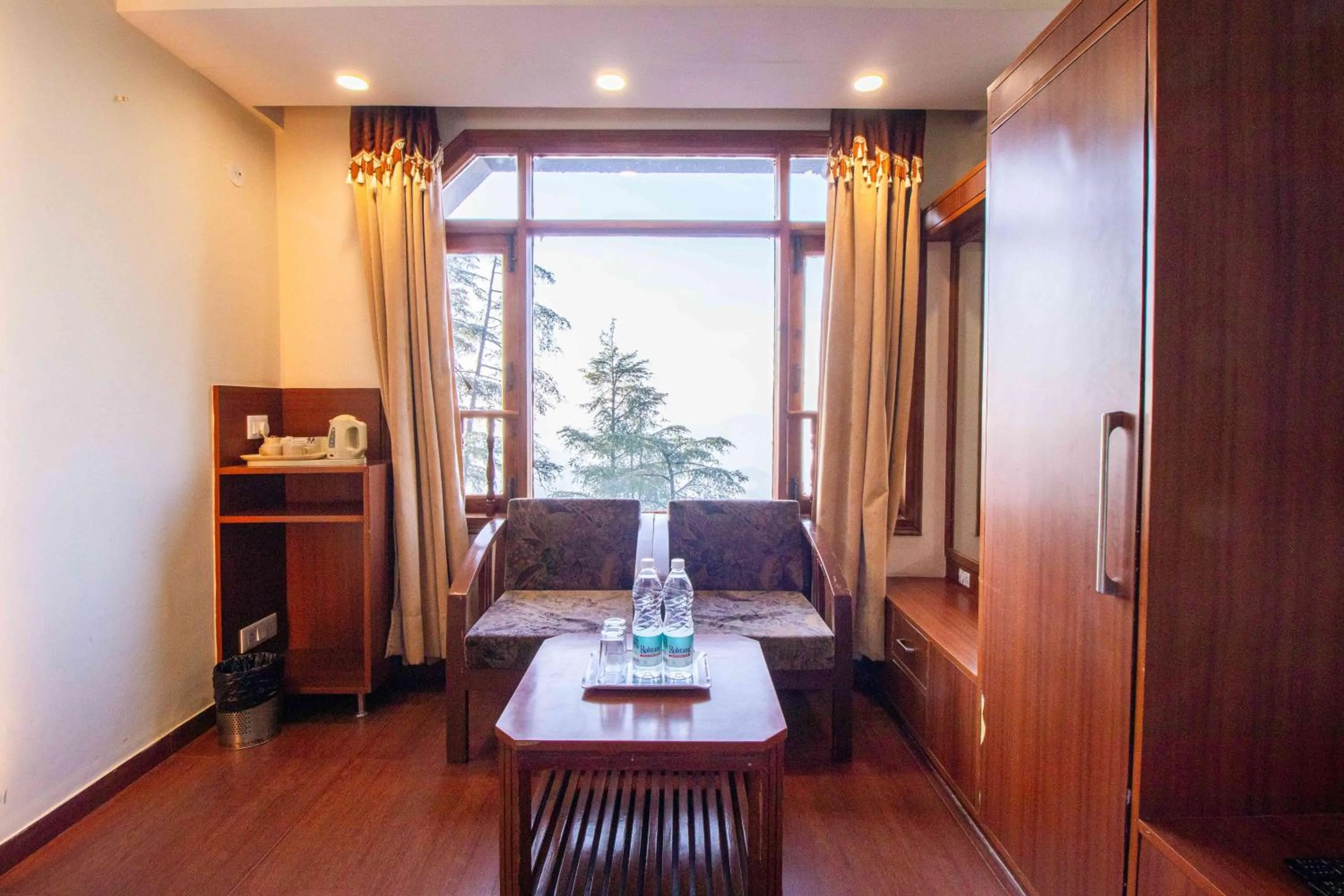 Bedroom in Treebo Varuna With Mountain View