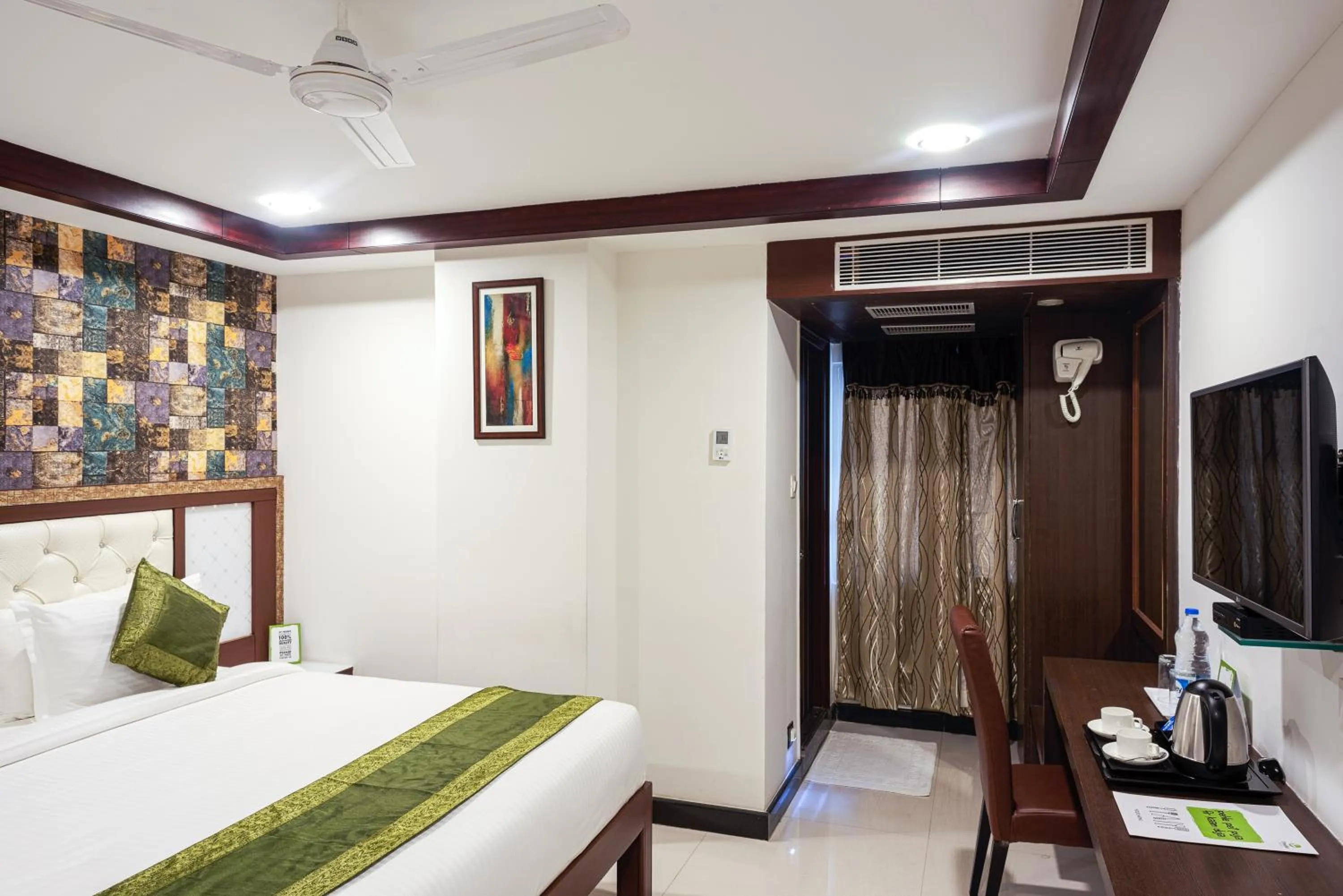 Bedroom, Bed in Treebo Empire