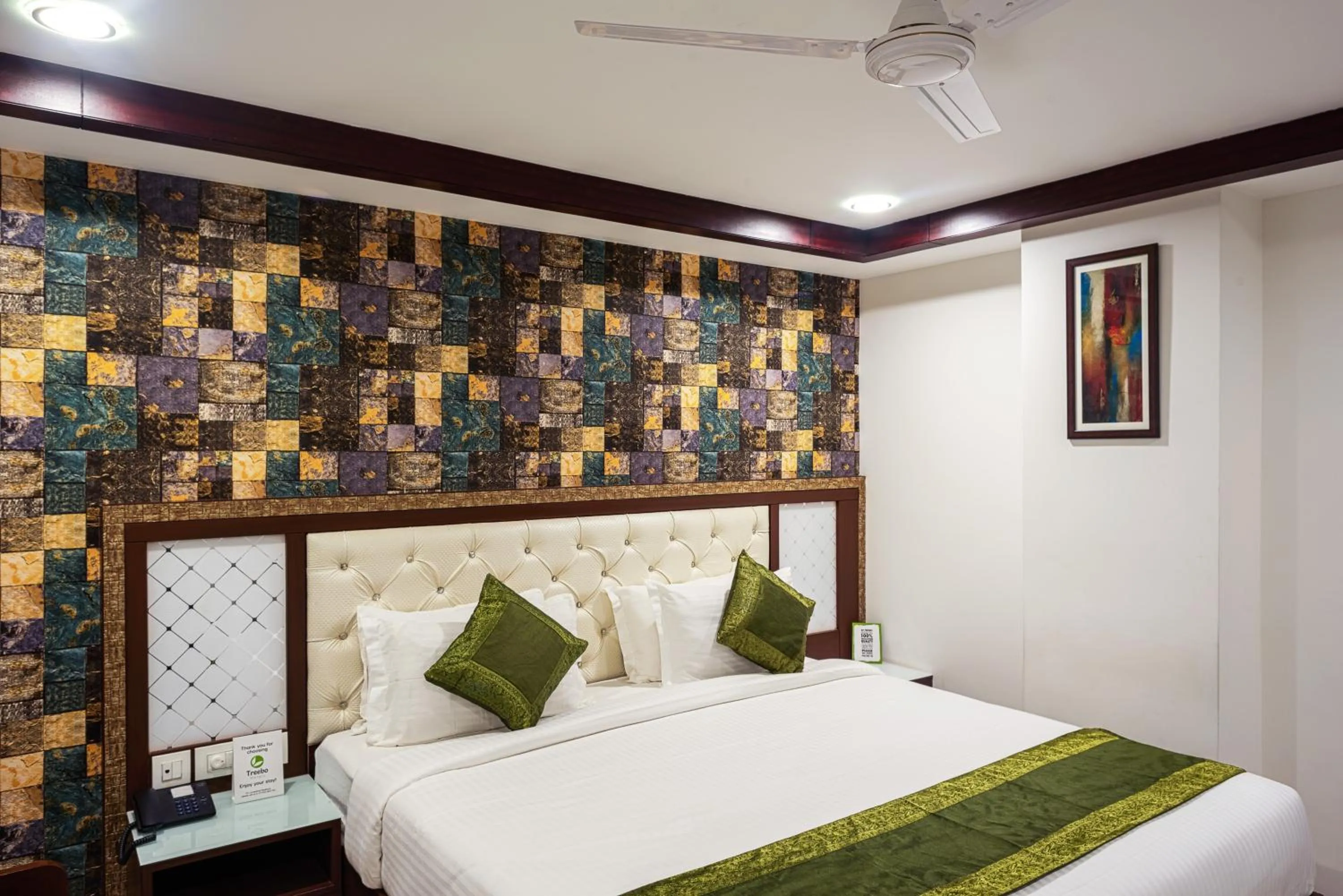 Bedroom, Bed in Treebo Empire