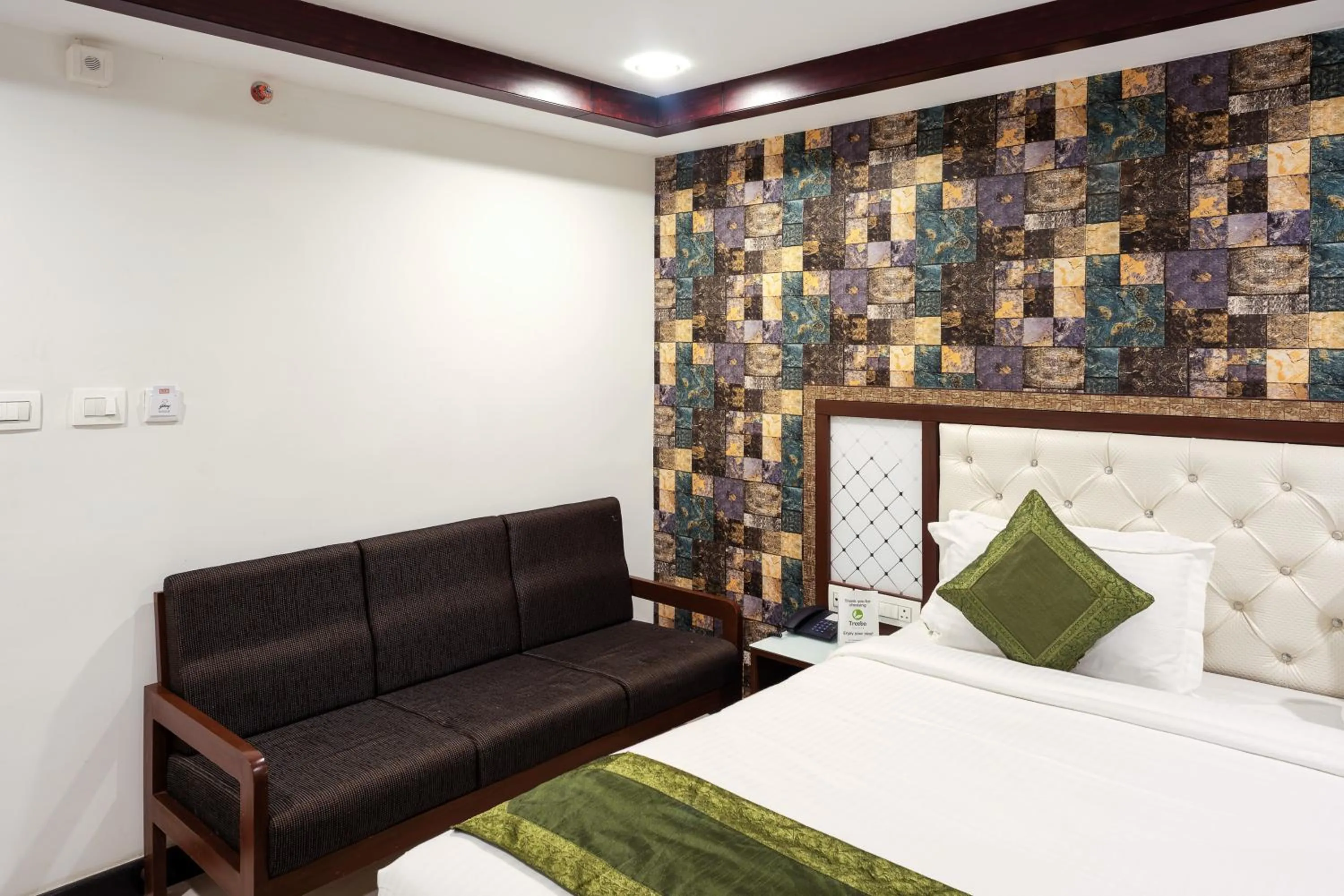 Bedroom, Bed in Treebo Empire