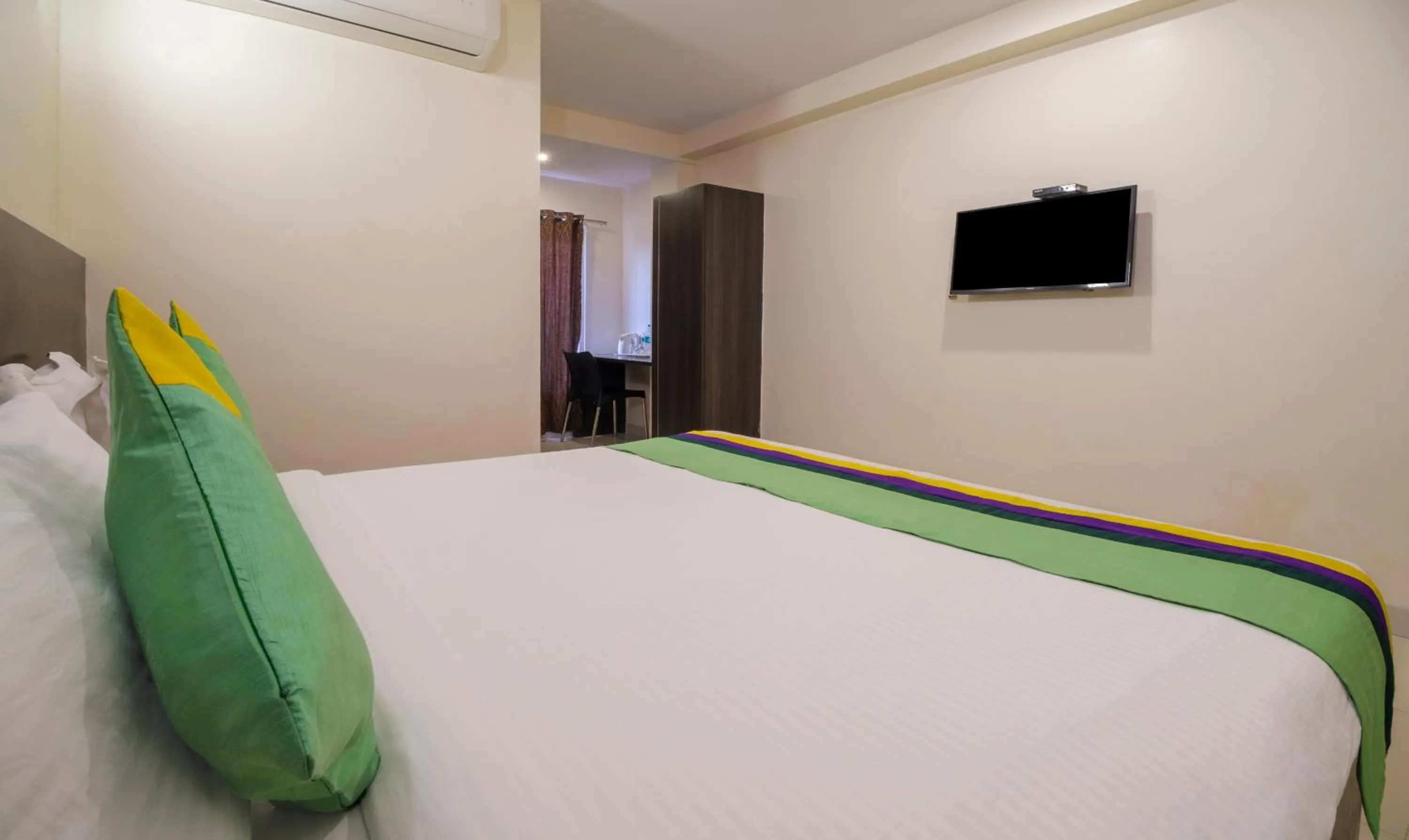 Photo of the whole room, Bed in Treebo MVP Grand