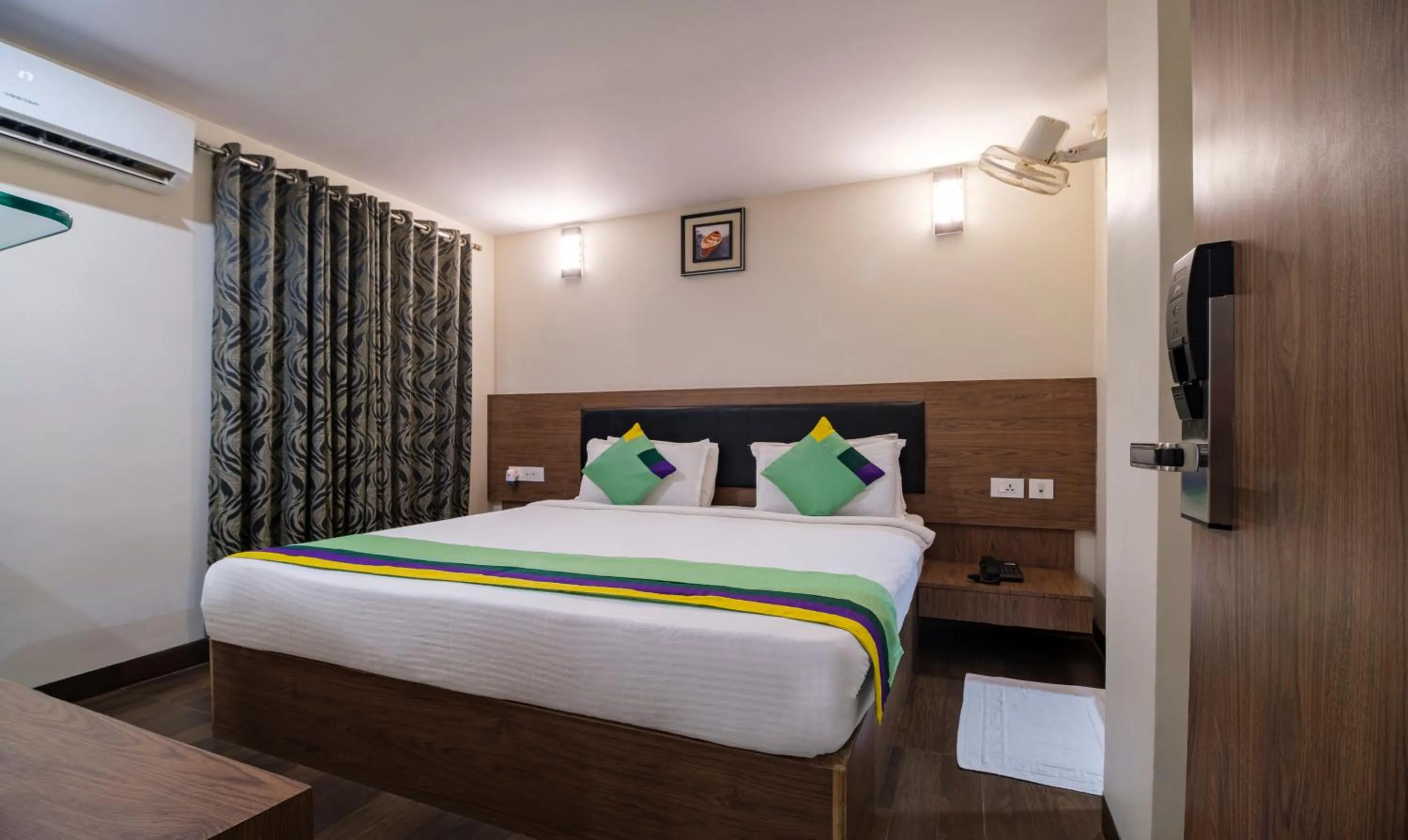 Photo of the whole room, Bed in Treebo MVP Grand