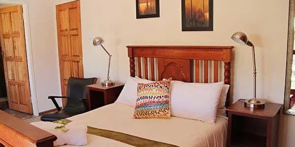 Bed in Greenleaf Guest Lodge