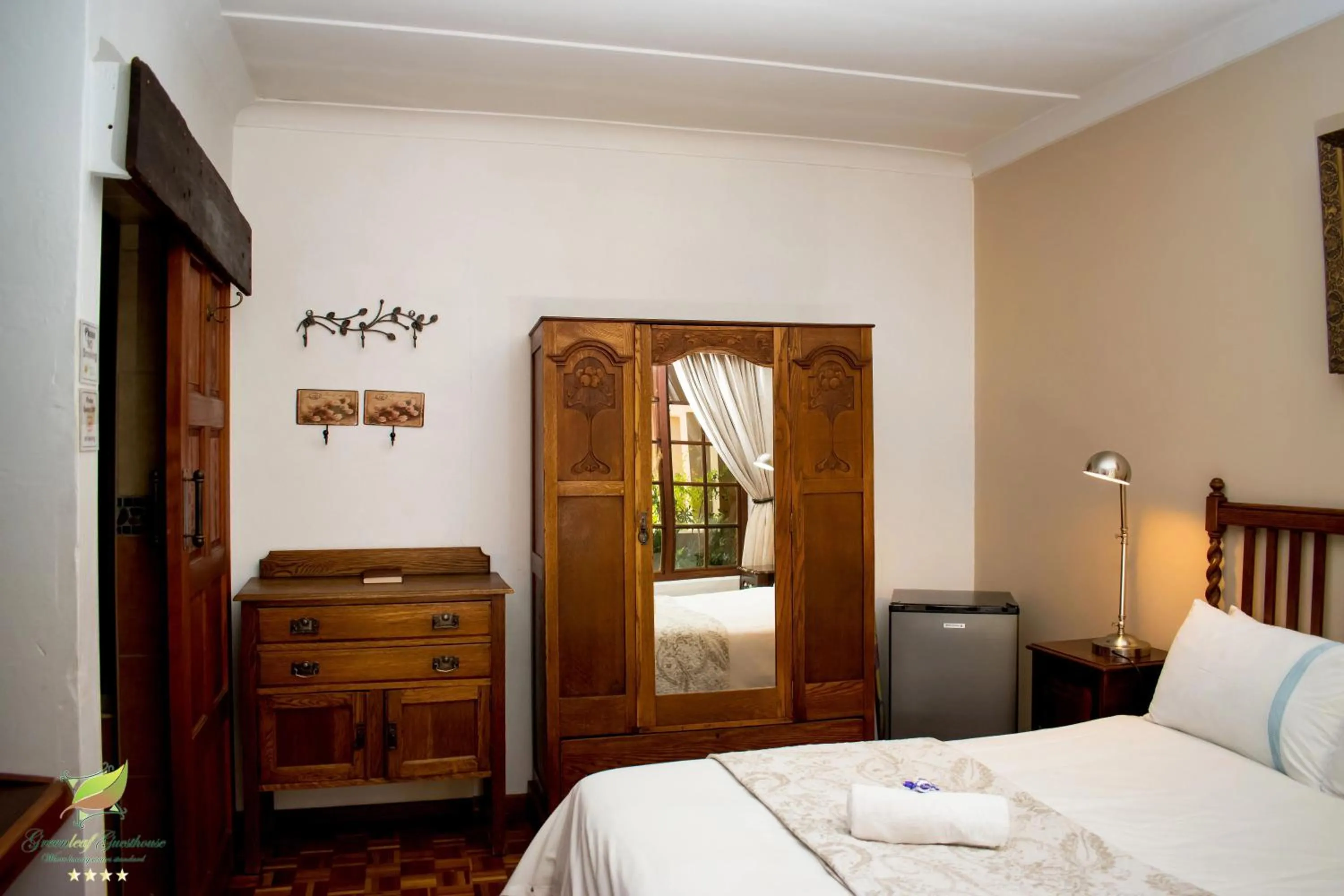 Bed in Greenleaf Guest Lodge