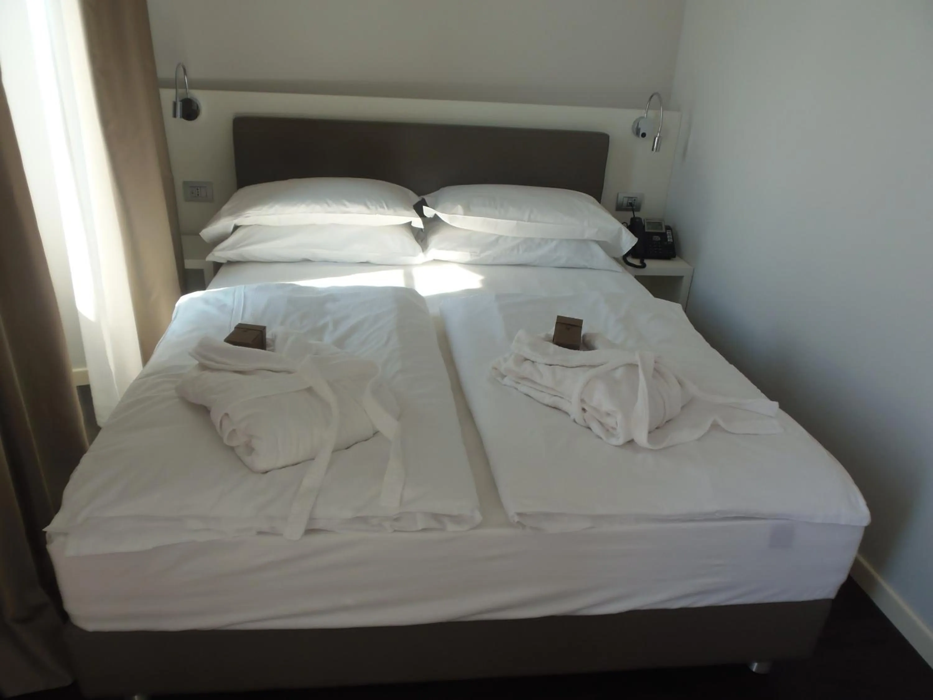 Bed in Albergo Dongo