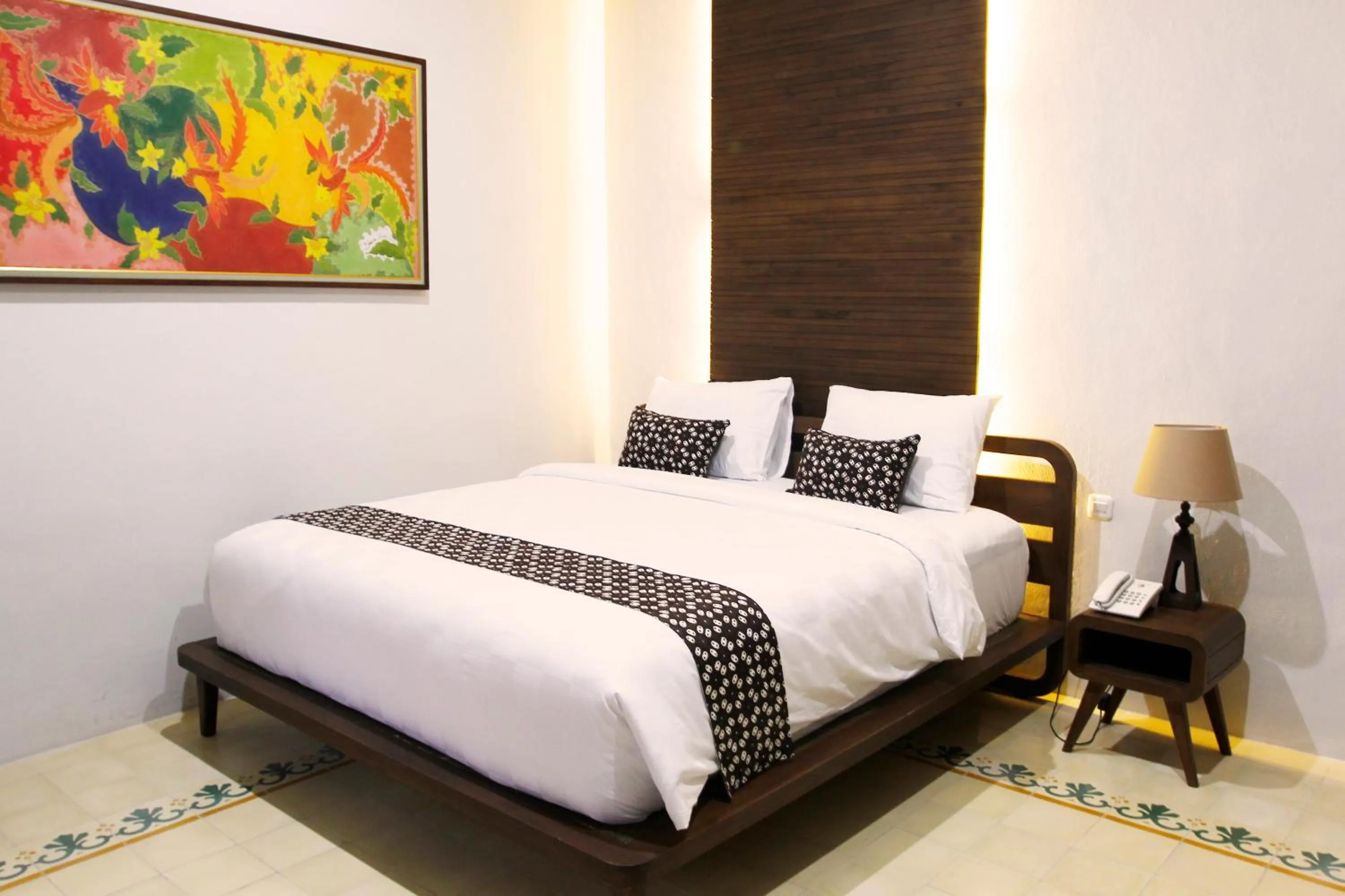 Bed in Joglo Mandapa Boutique Hotel