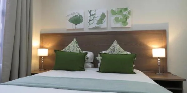 Bed in Sunbird Garden Cottage