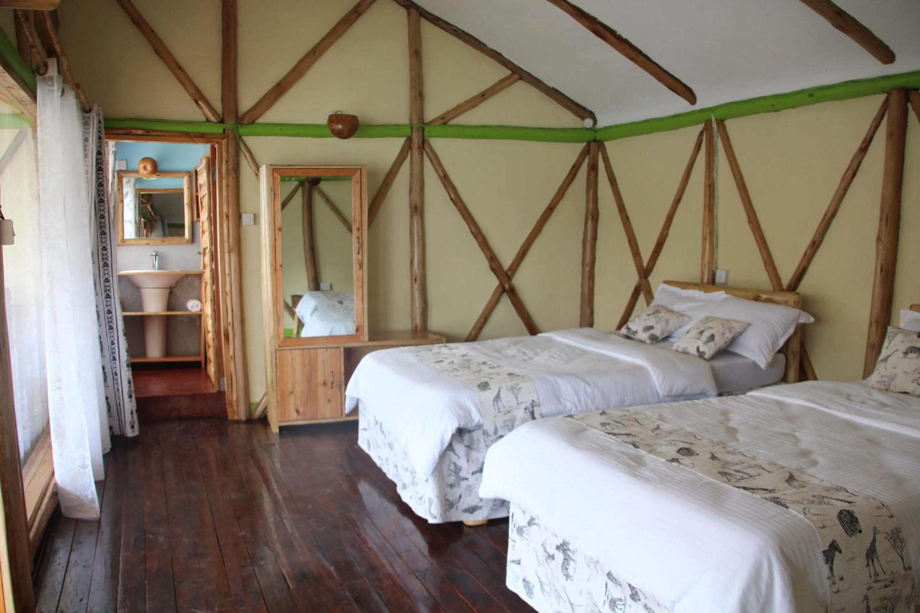 Bed in Lake Bunyonyi Rock Resort