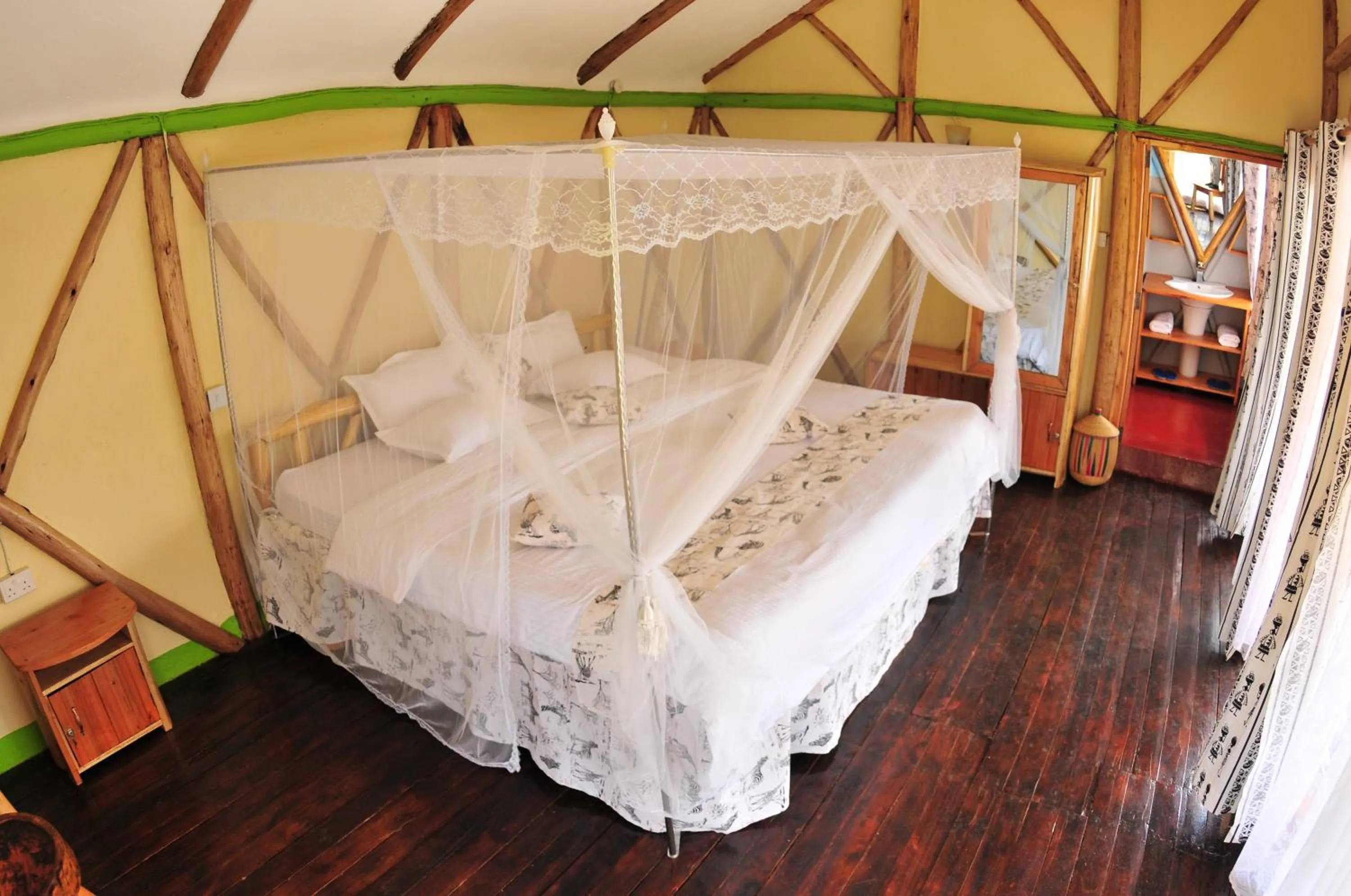 Bed in Lake Bunyonyi Rock Resort