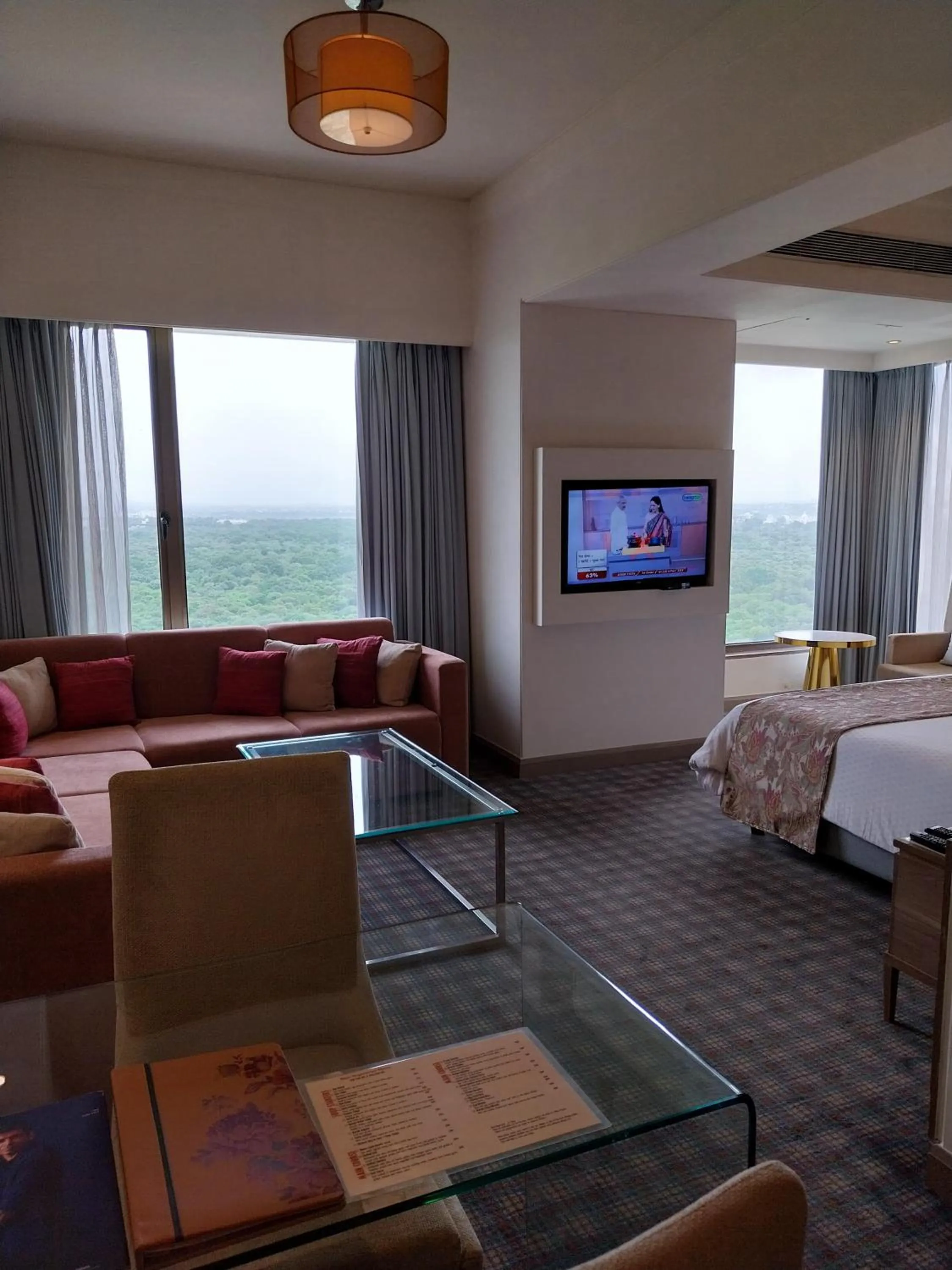 Seating area, Bed in Efcee Sarovar Premiere Bhavnagar