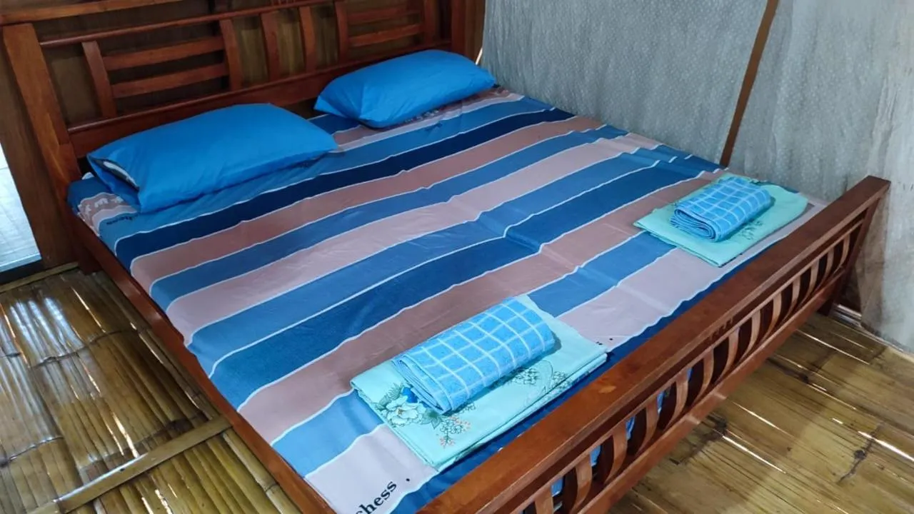 Bed in Taun Gusi Village Homestay