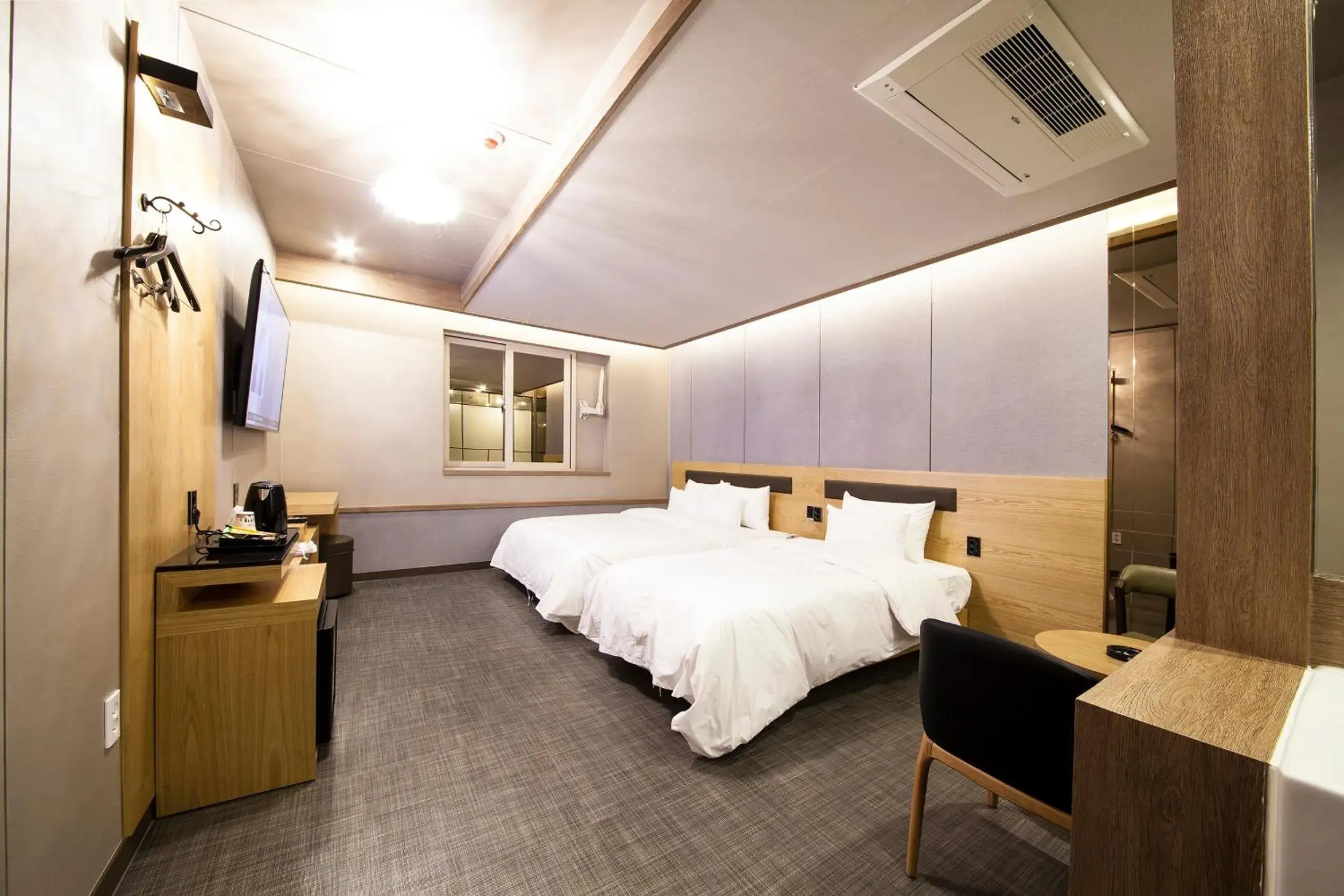 Bed in Jinju Kai Hotel Bed in Jinju Kai Hotel