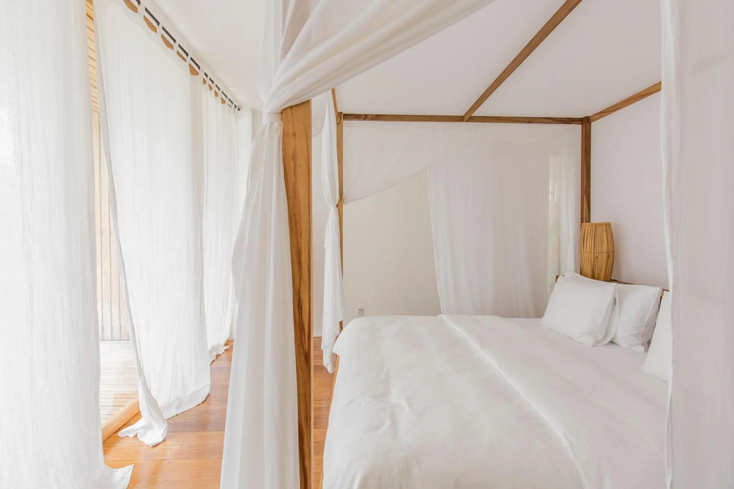 Bed in KA BRU Beach Boutique Hotel