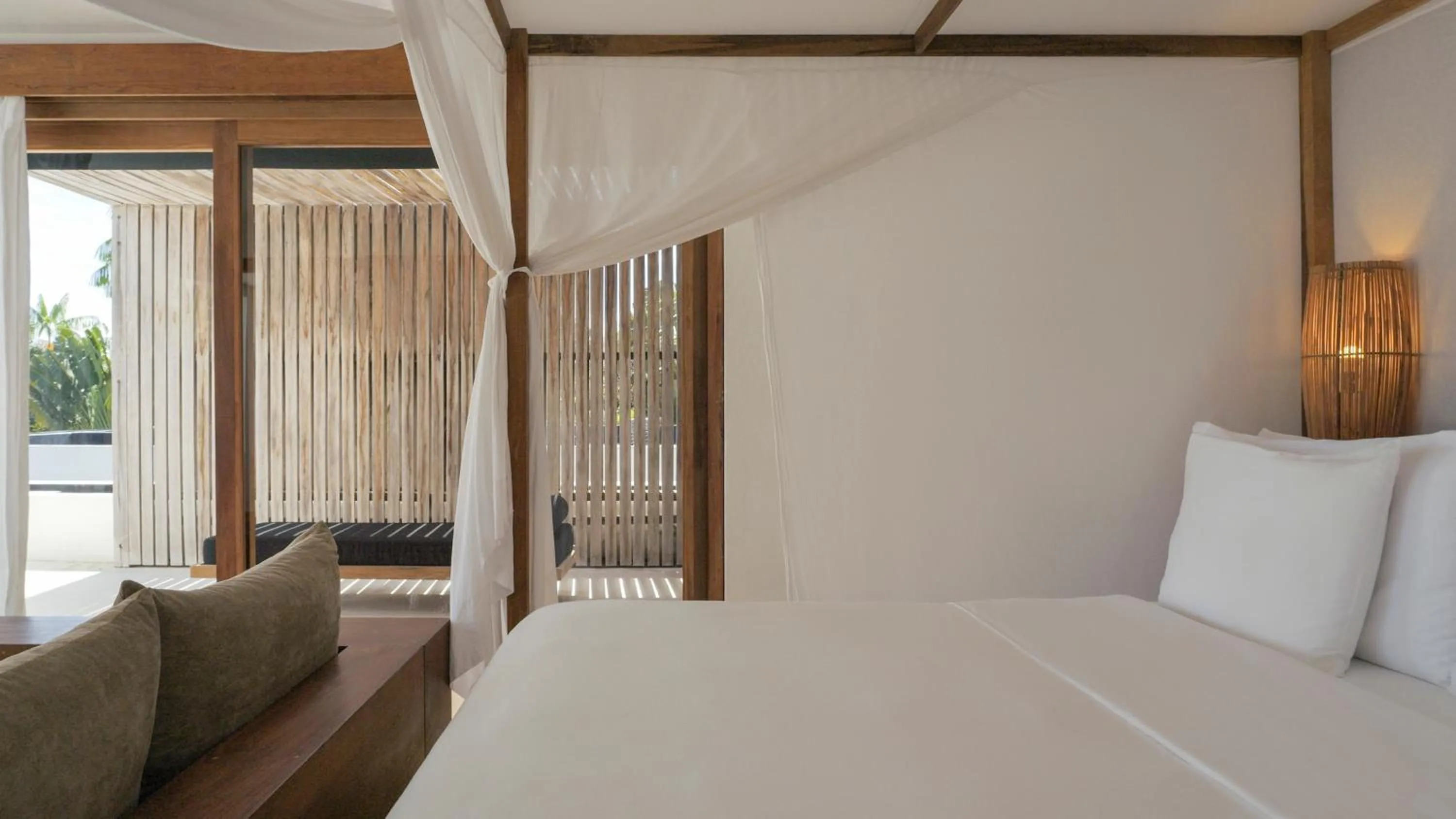 Bed in KA BRU Beach Boutique Hotel