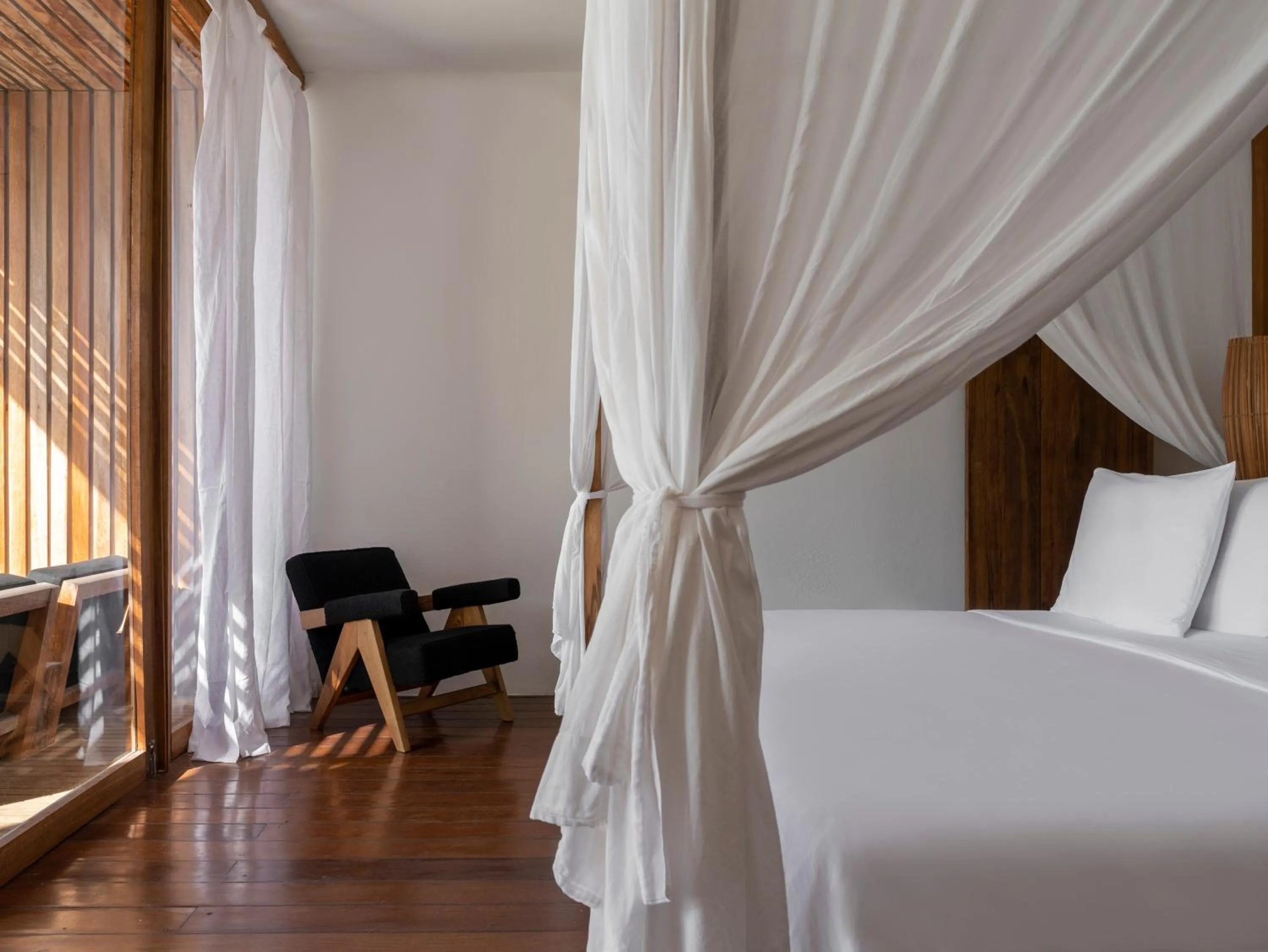 Bed in KA BRU Beach Boutique Hotel