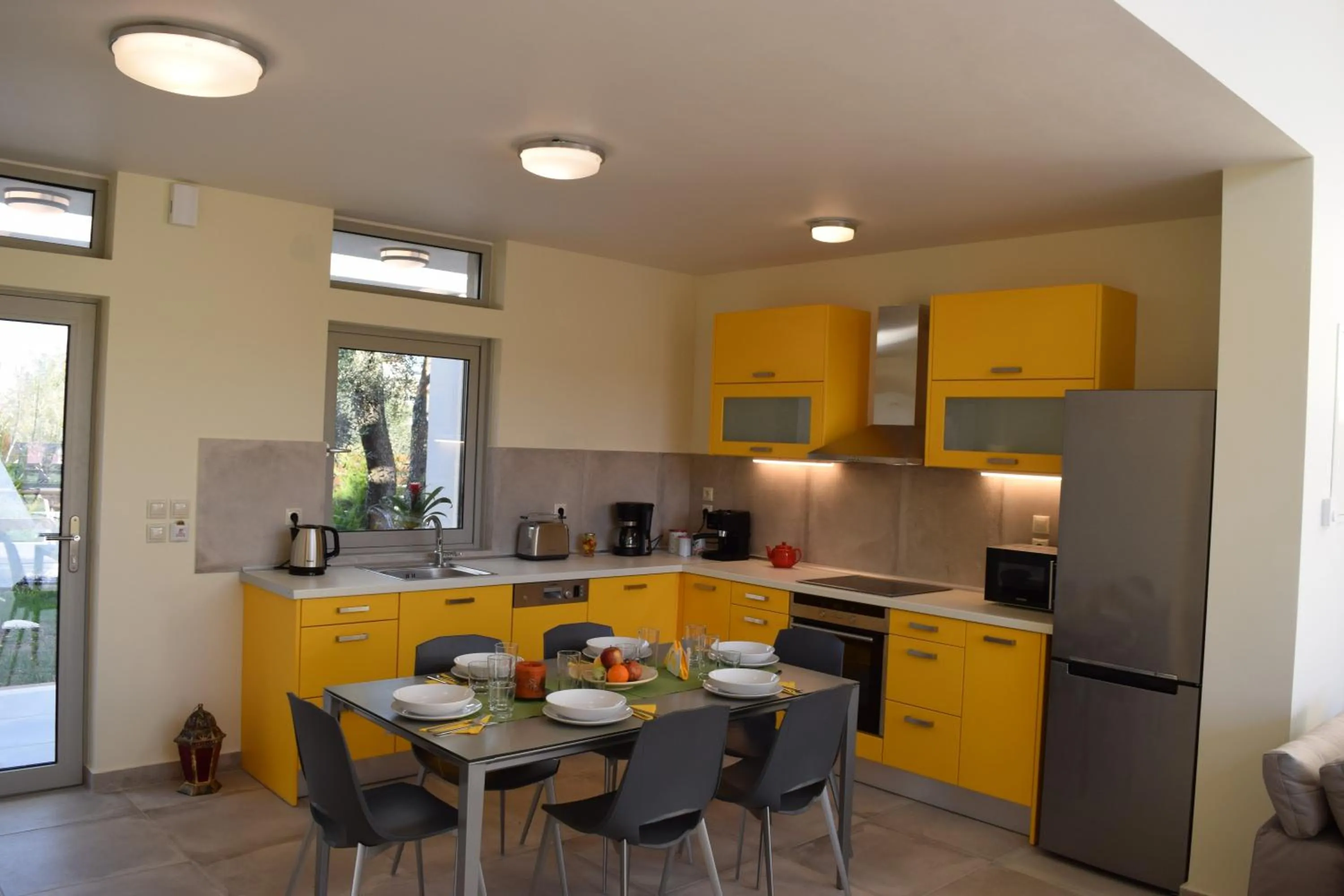 Kitchen or kitchenette in Three Stars Luxury Villas