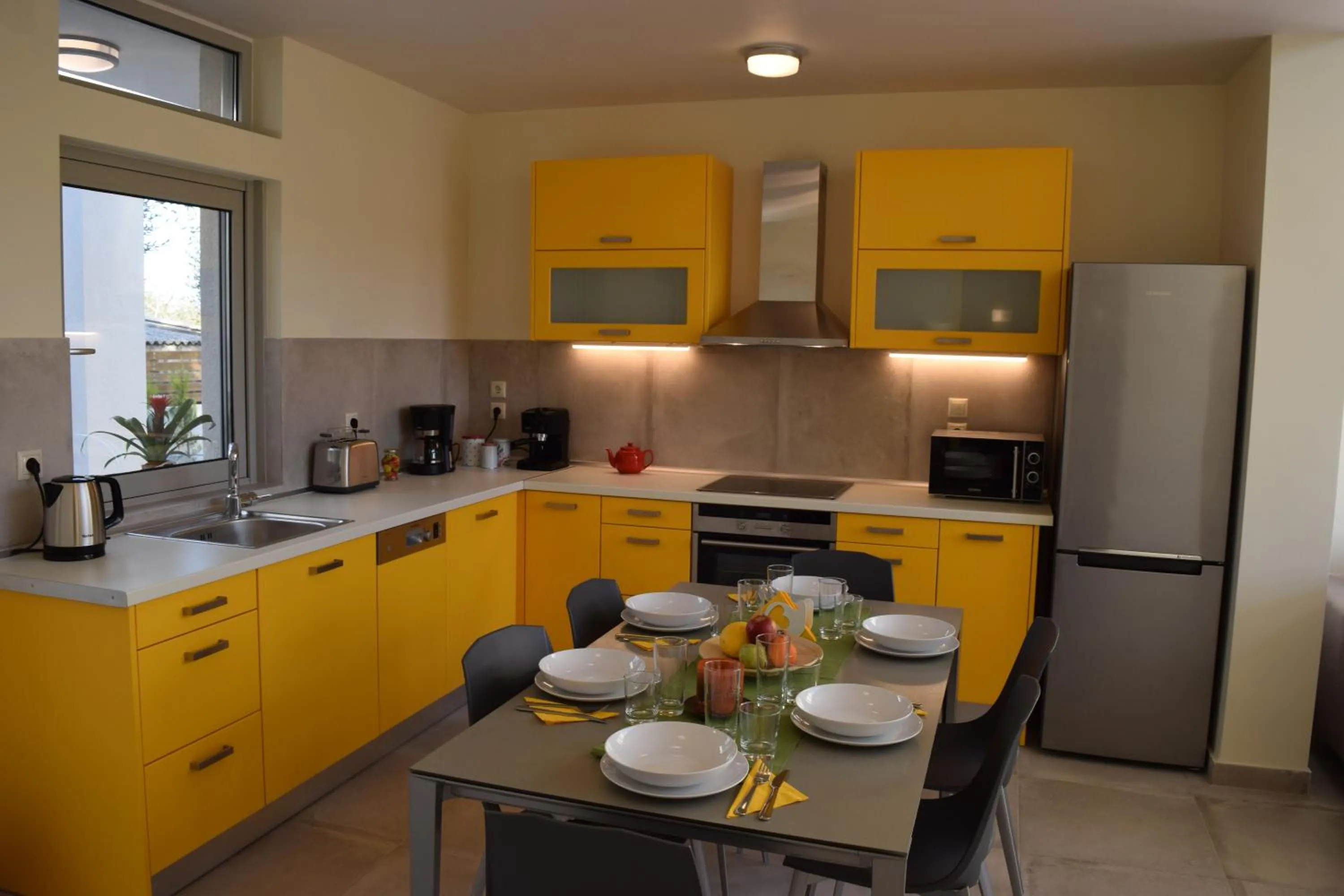 Kitchen or kitchenette in Three Stars Luxury Villas