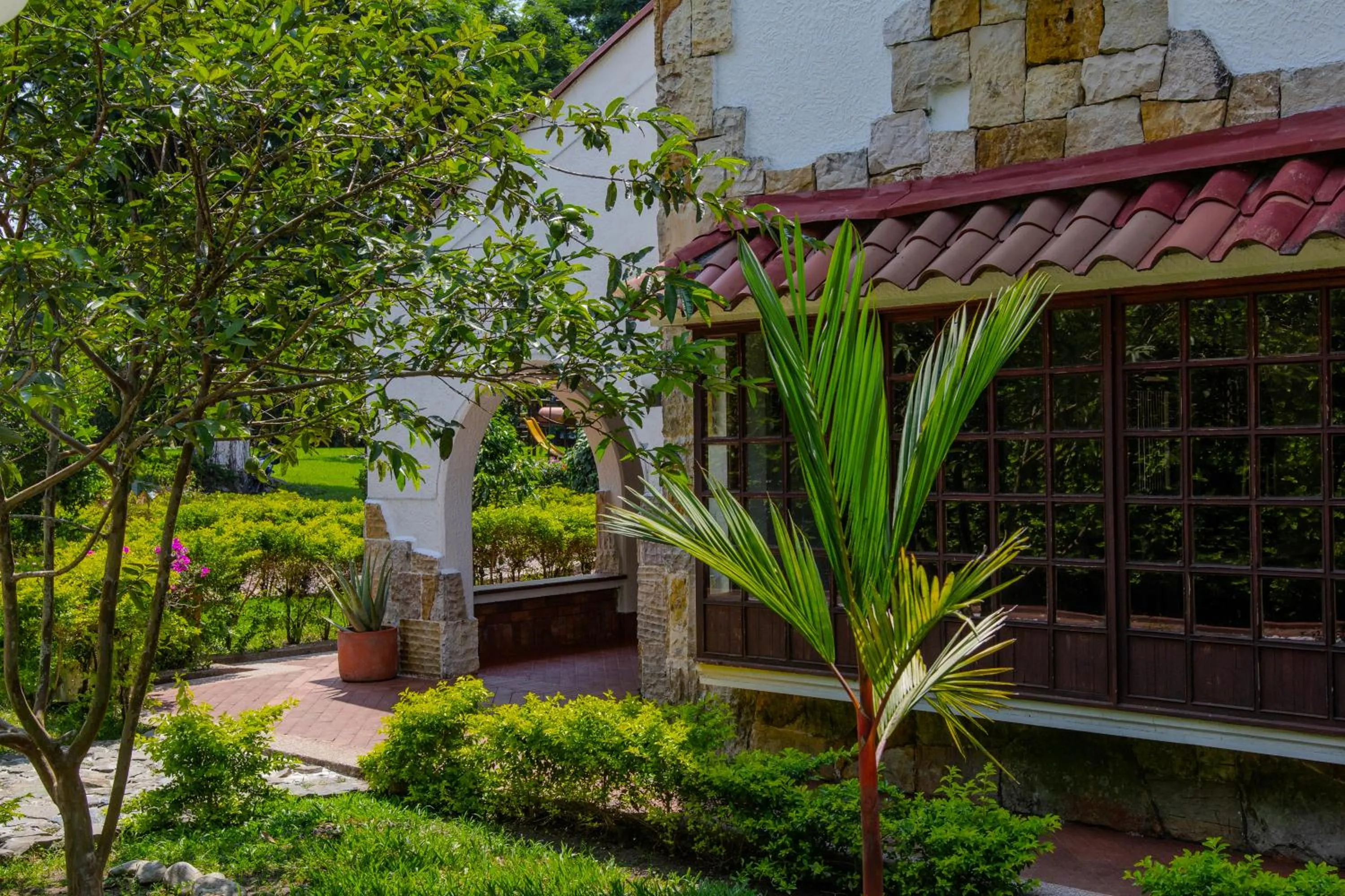 Garden view in Hotel Chalet El Castillo by Majuva