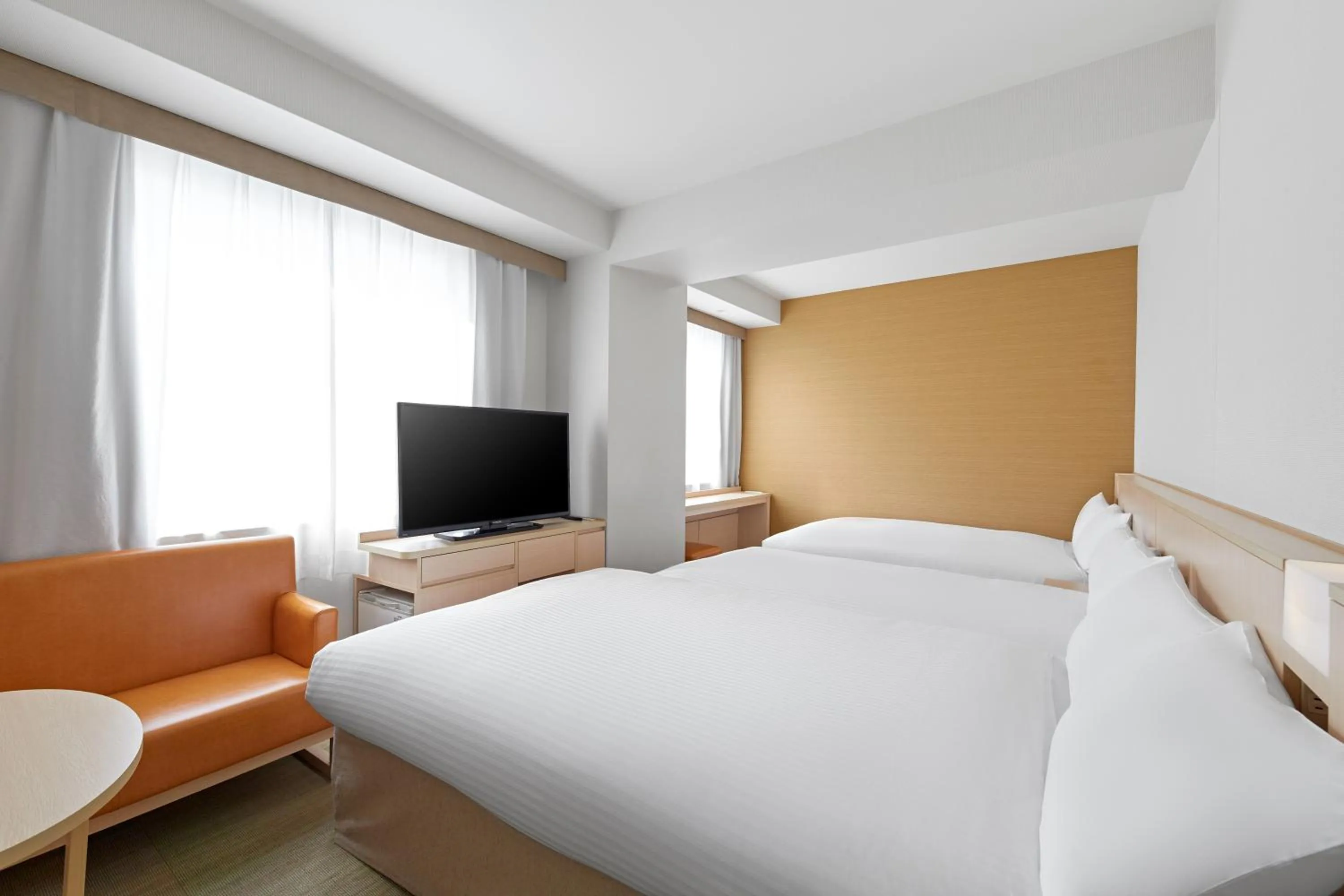 Bed in Sotetsu Fresa Inn Kyoto-Shijokarasuma