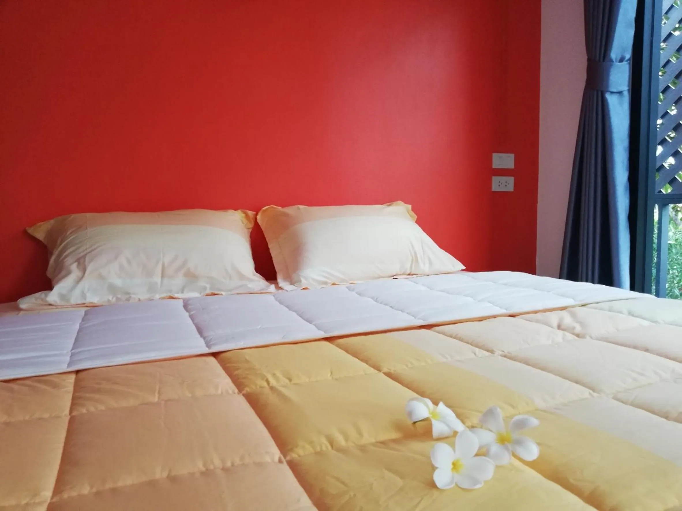 Bed in T'Luck House Resort