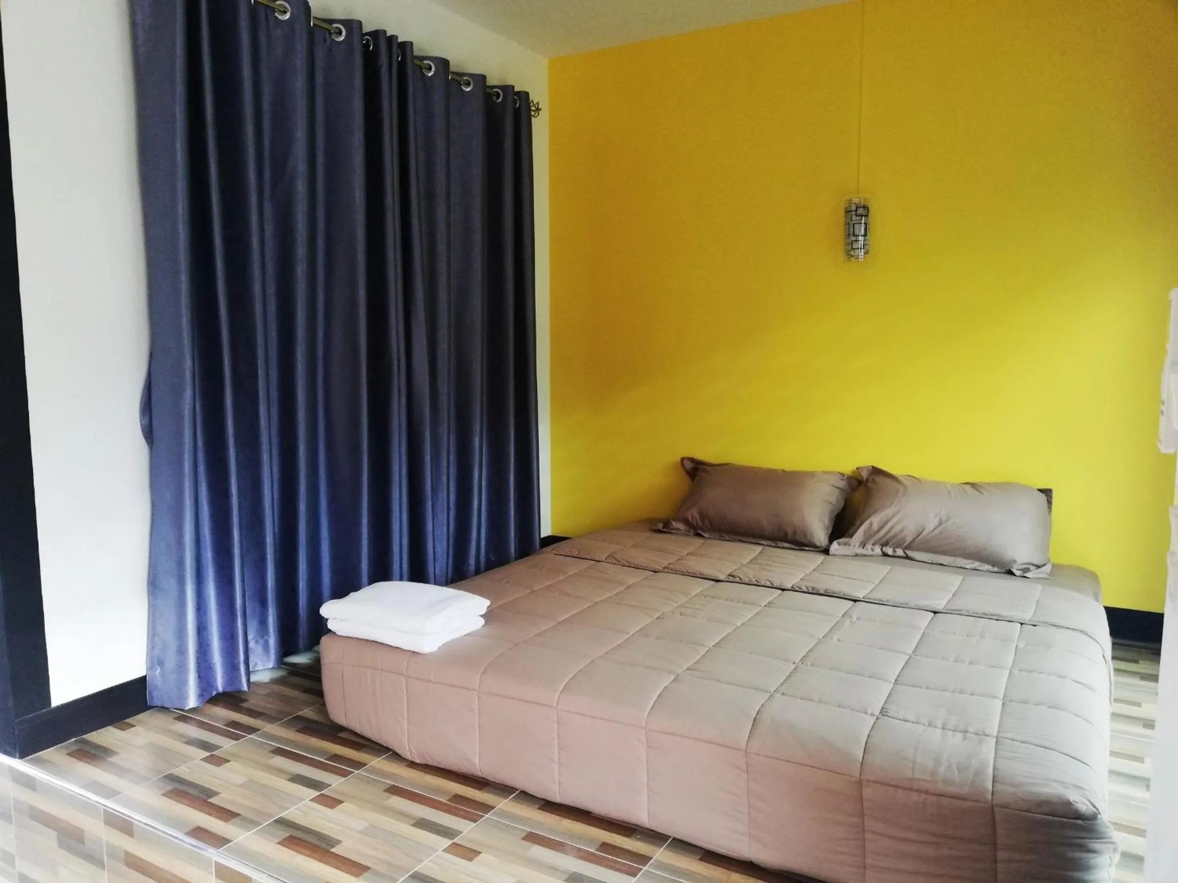 Bed in T'Luck House Resort