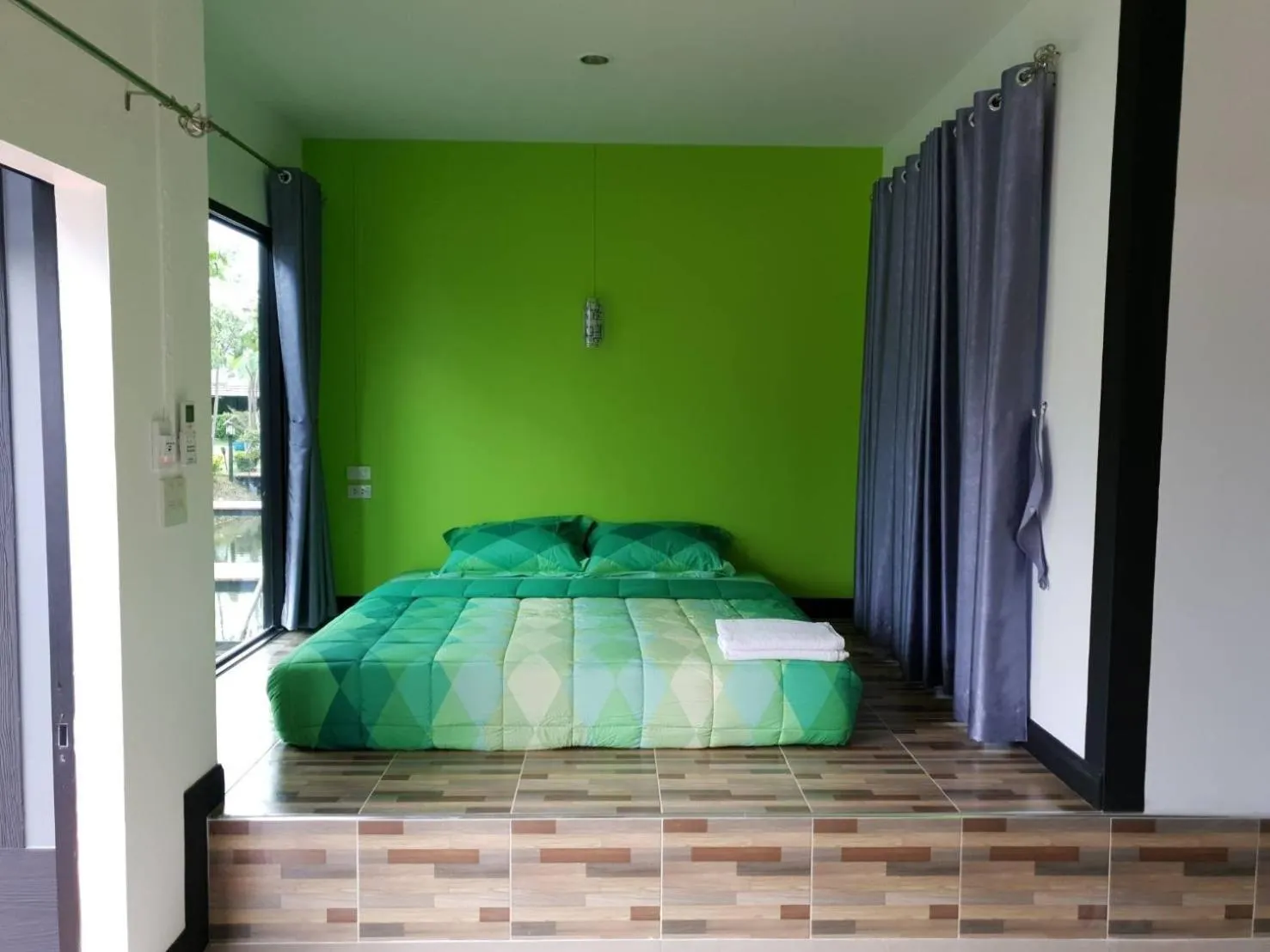 Bed in T'Luck House Resort