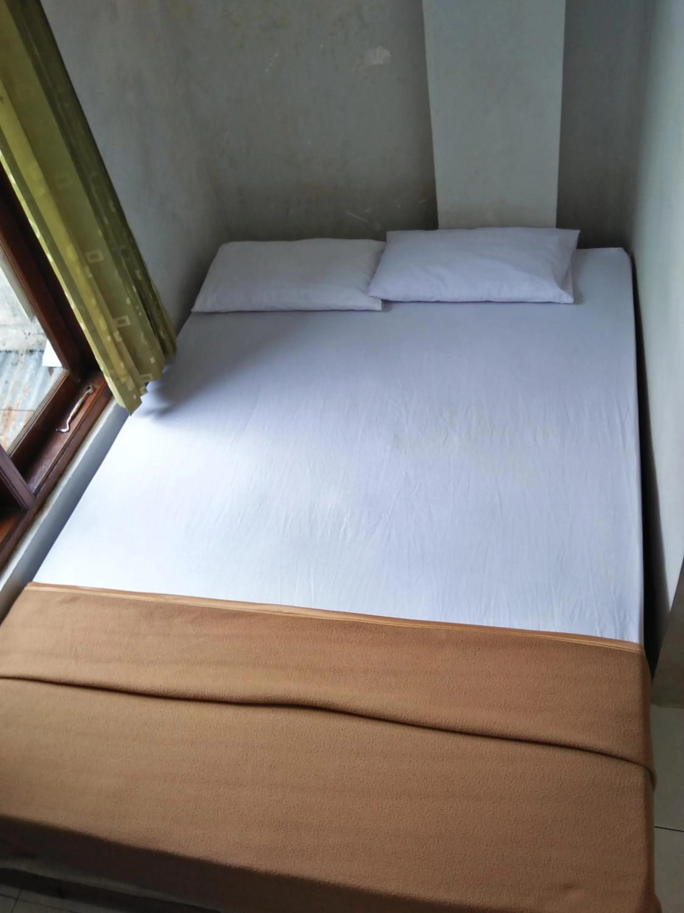 Bed in Losmen Fadel Malioboro Jogja