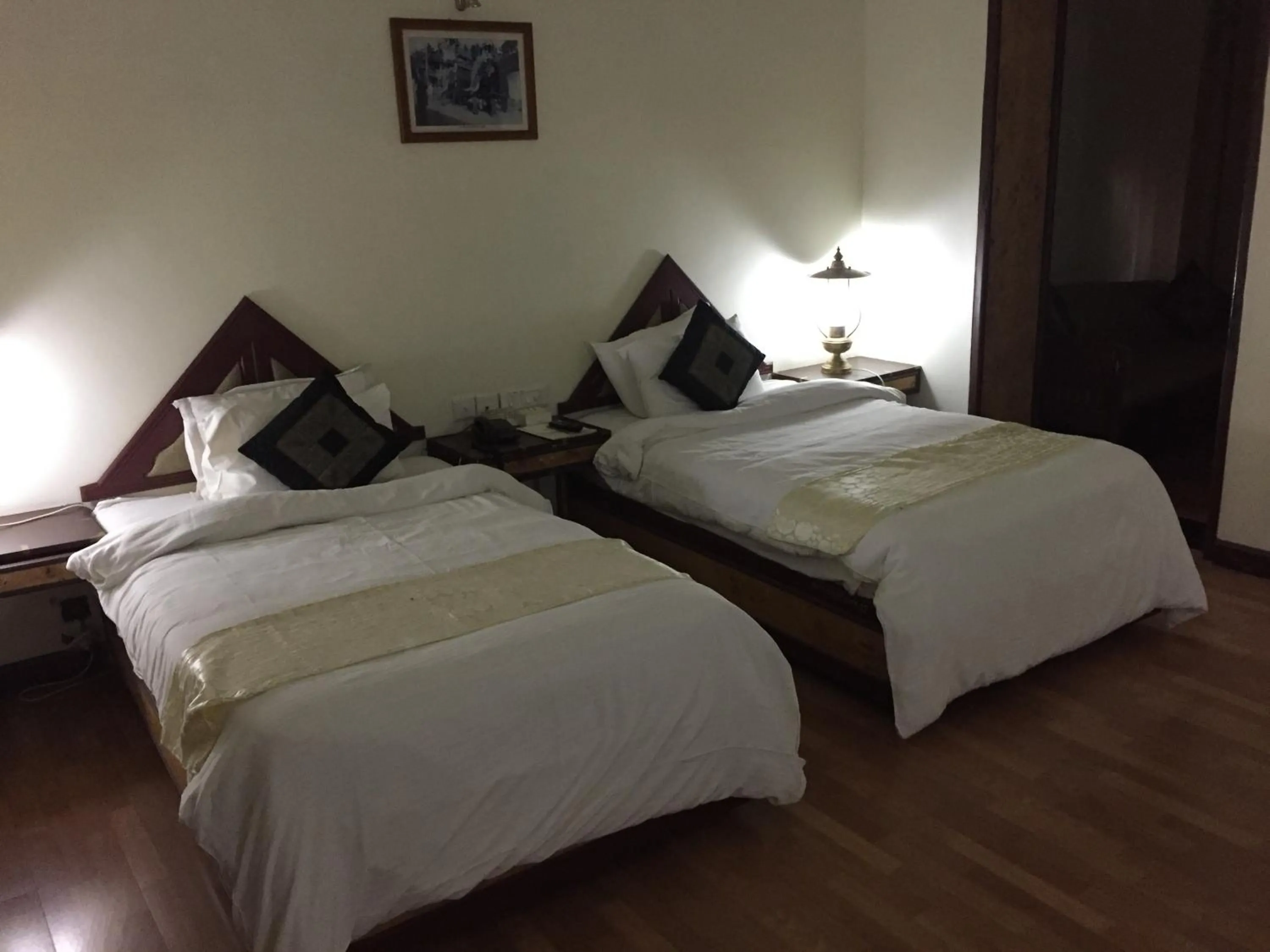 Bed in KTDC Mascot Hotel - A Heritage Living Experience