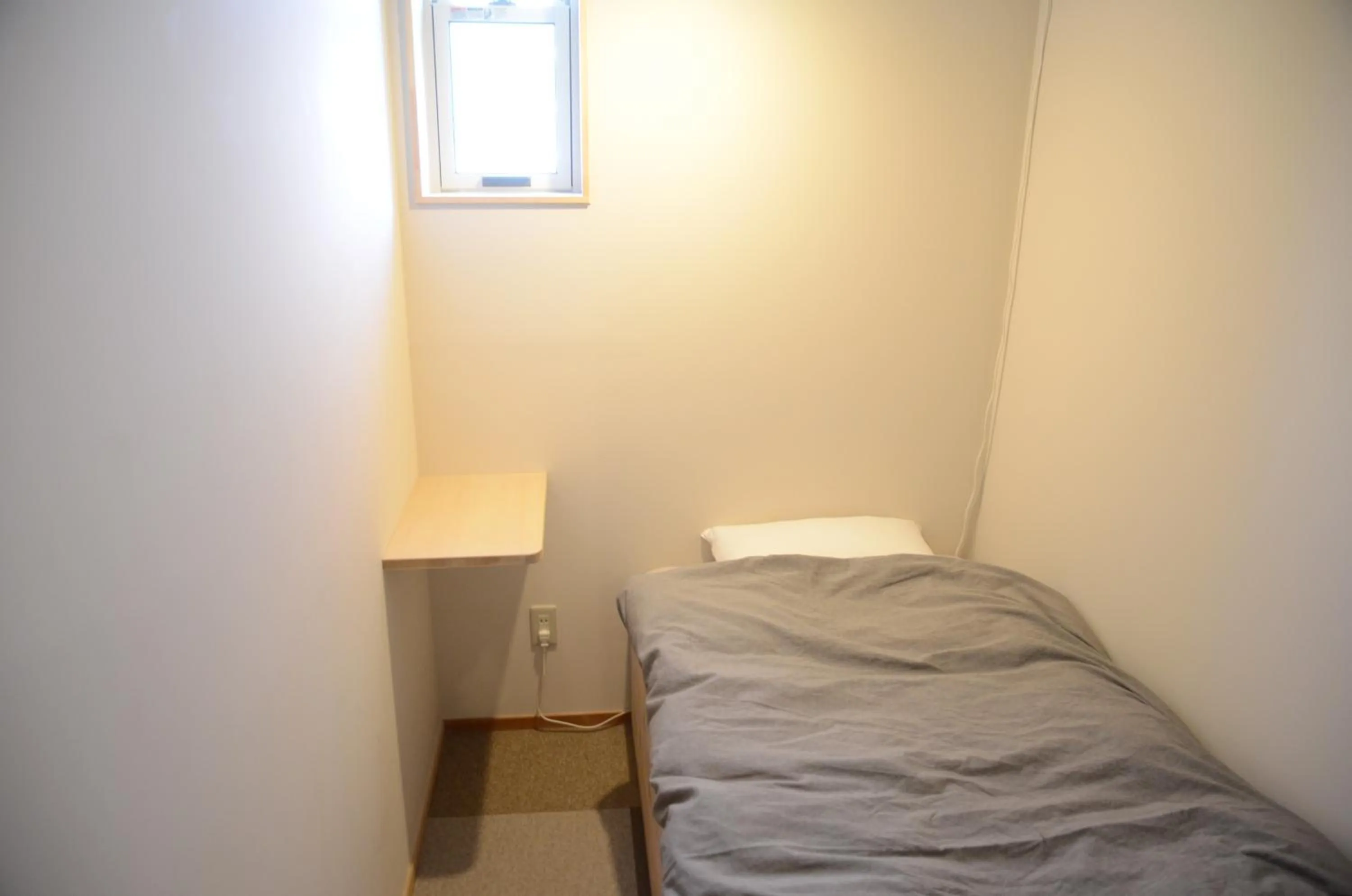 Bed in Sai no Tsuno Guest House