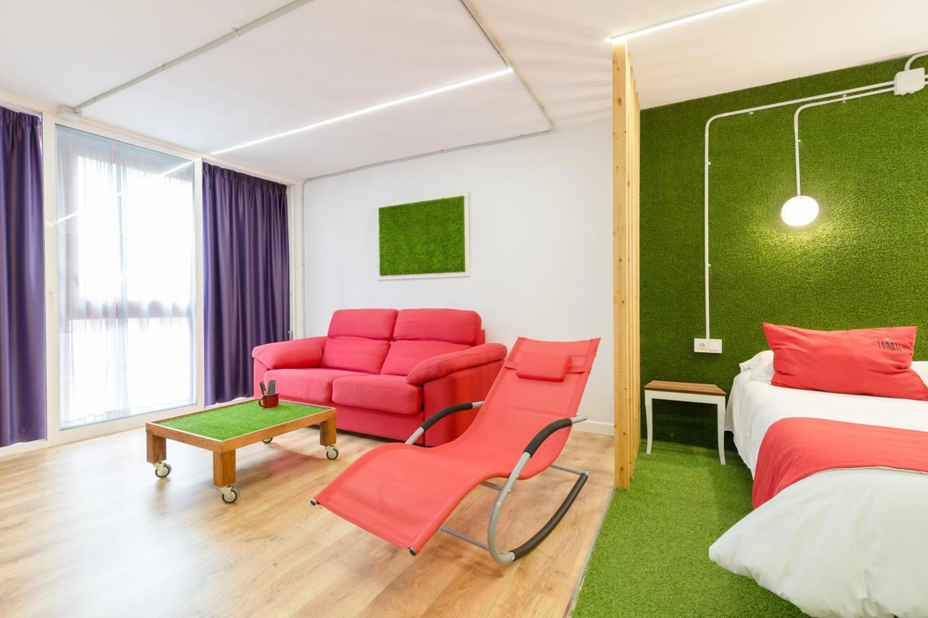 Bed in Tomate Rooms