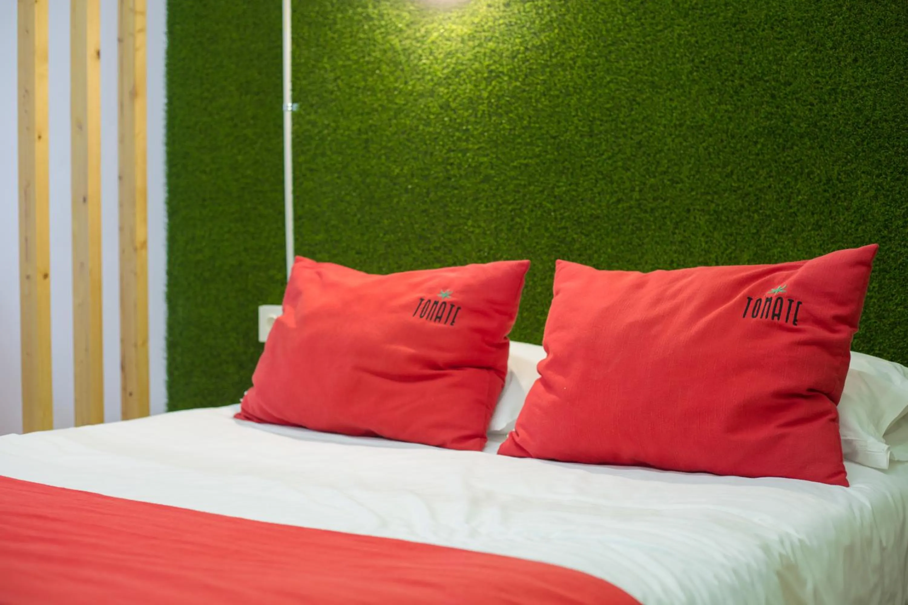 Bed in Tomate Rooms