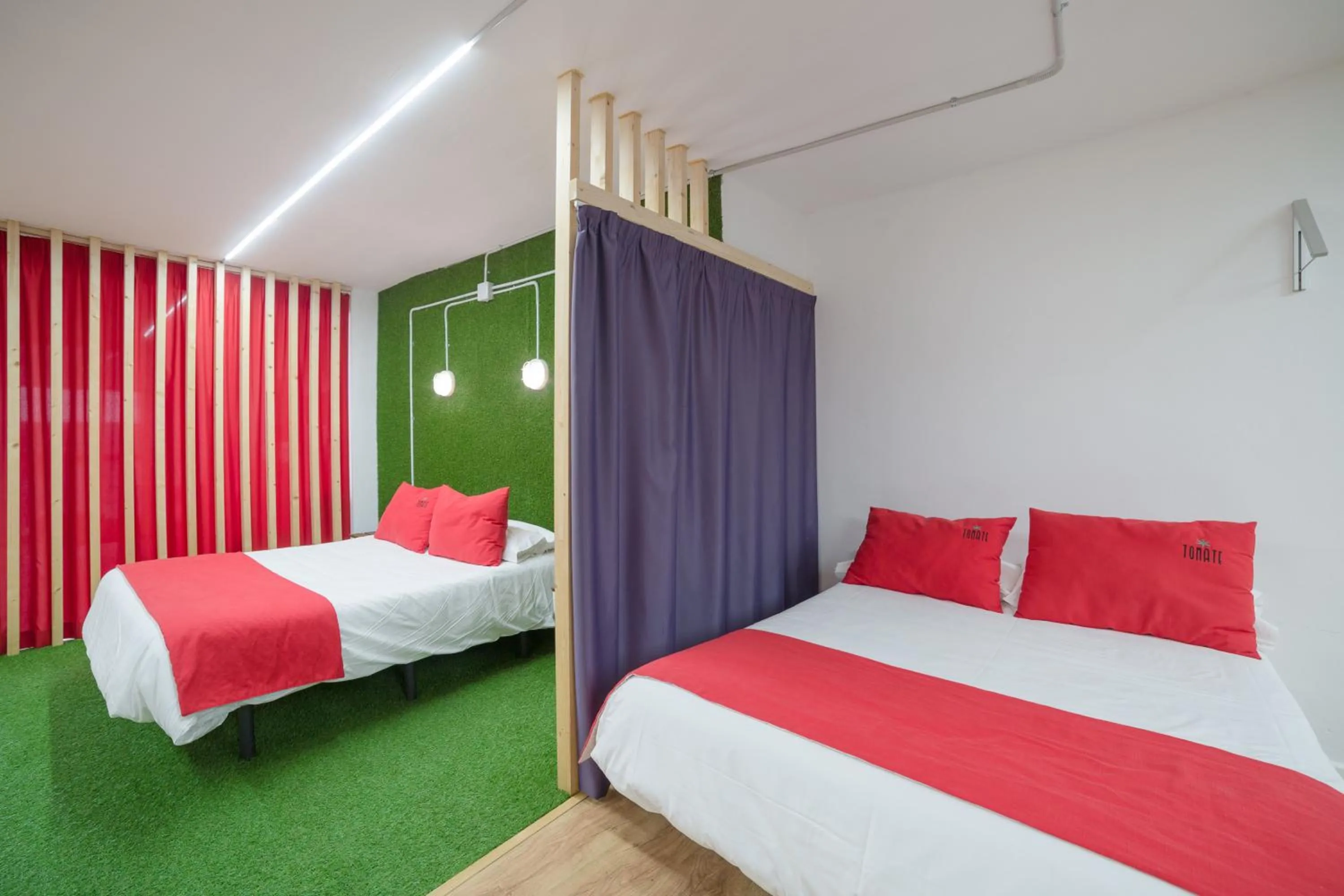 Bed in Tomate Rooms